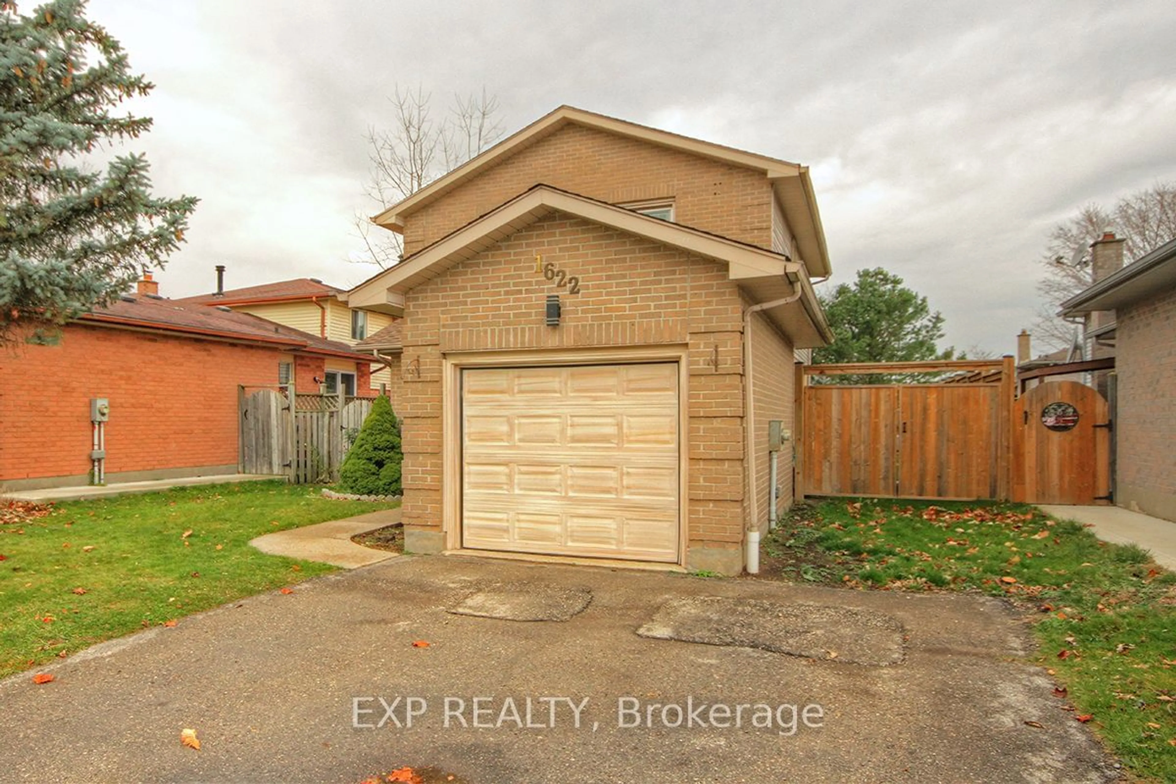 Frontside or backside of a home, the fenced backyard for 1622 Jalna Blvd, London Ontario N6E 3L1