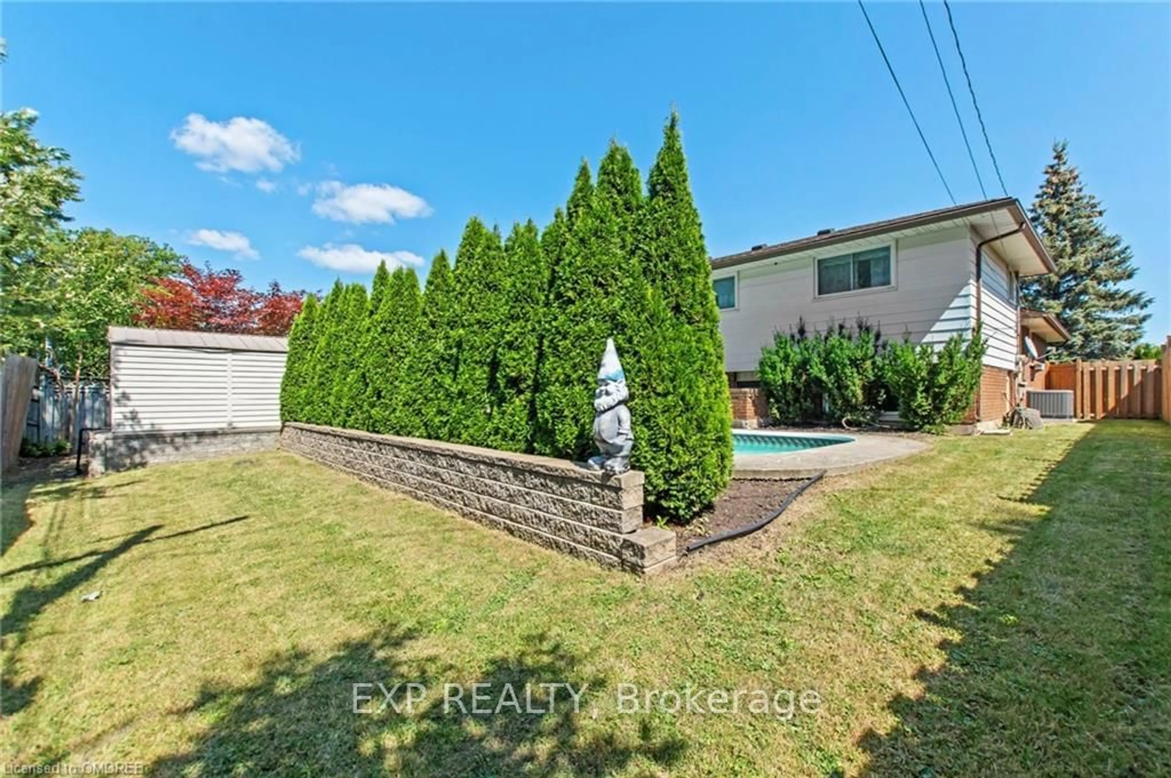 Frontside or backside of a home, the fenced backyard for 75 MAUREEN Ave, Welland Ontario L3C 4H7