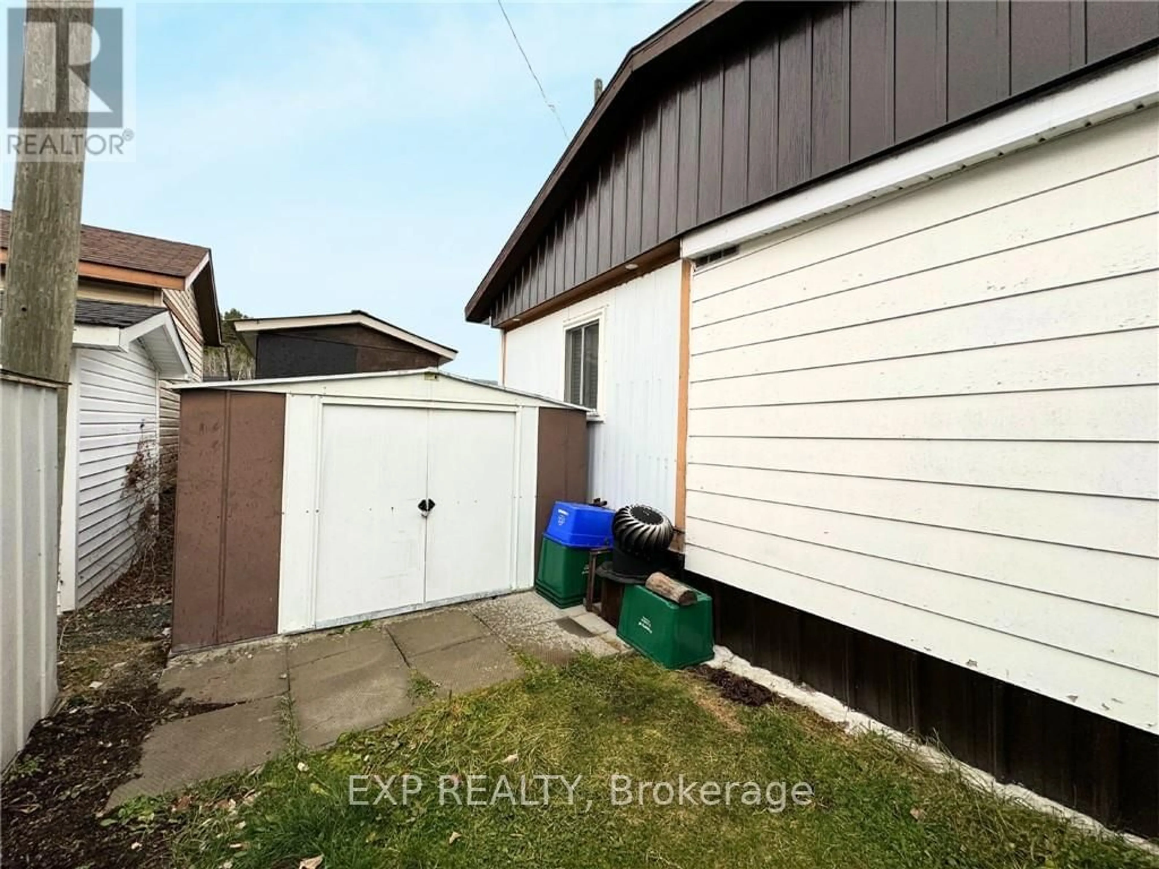 Frontside or backside of a home, the fenced backyard for 4 Center St, Greater Sudbury Ontario P0M 2C0