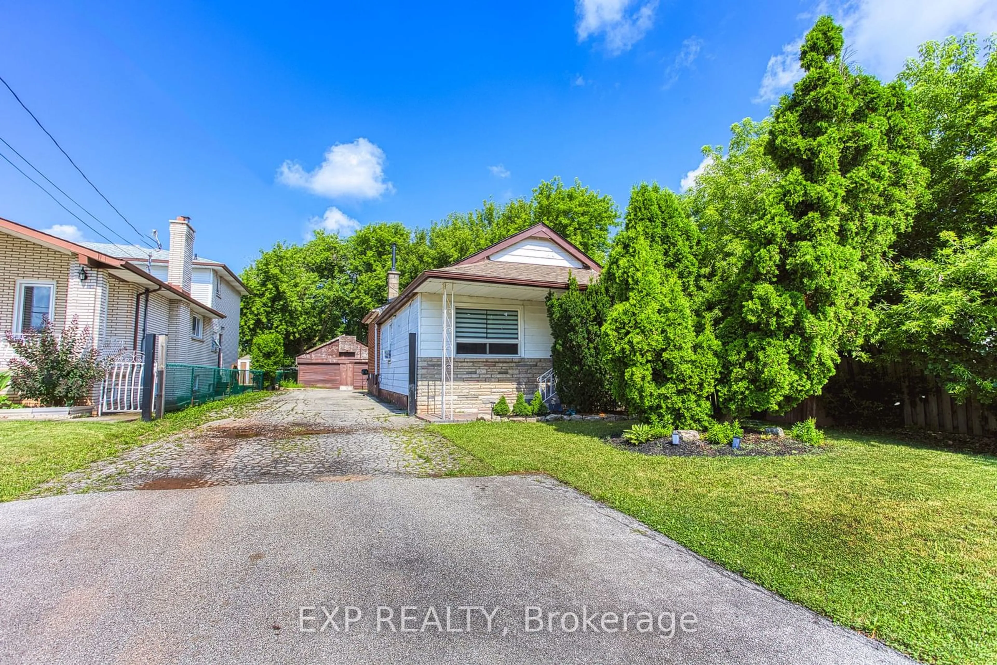 Frontside or backside of a home, the fenced backyard for 191 Margaret Ave, Hamilton Ontario L8E 2H6