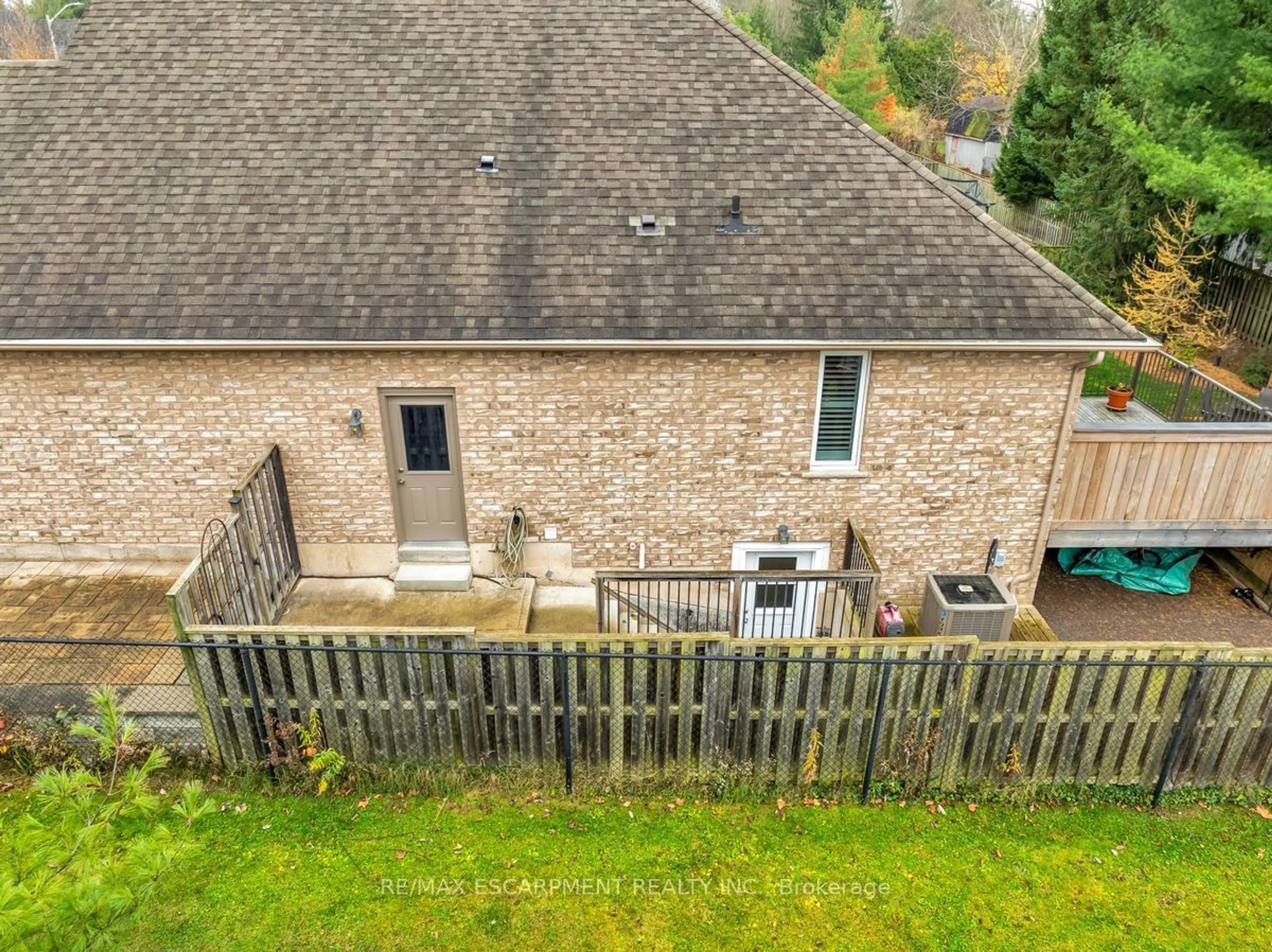 Frontside or backside of a home, the fenced backyard for 22 Martha Crt, Pelham Ontario L0S 1C0