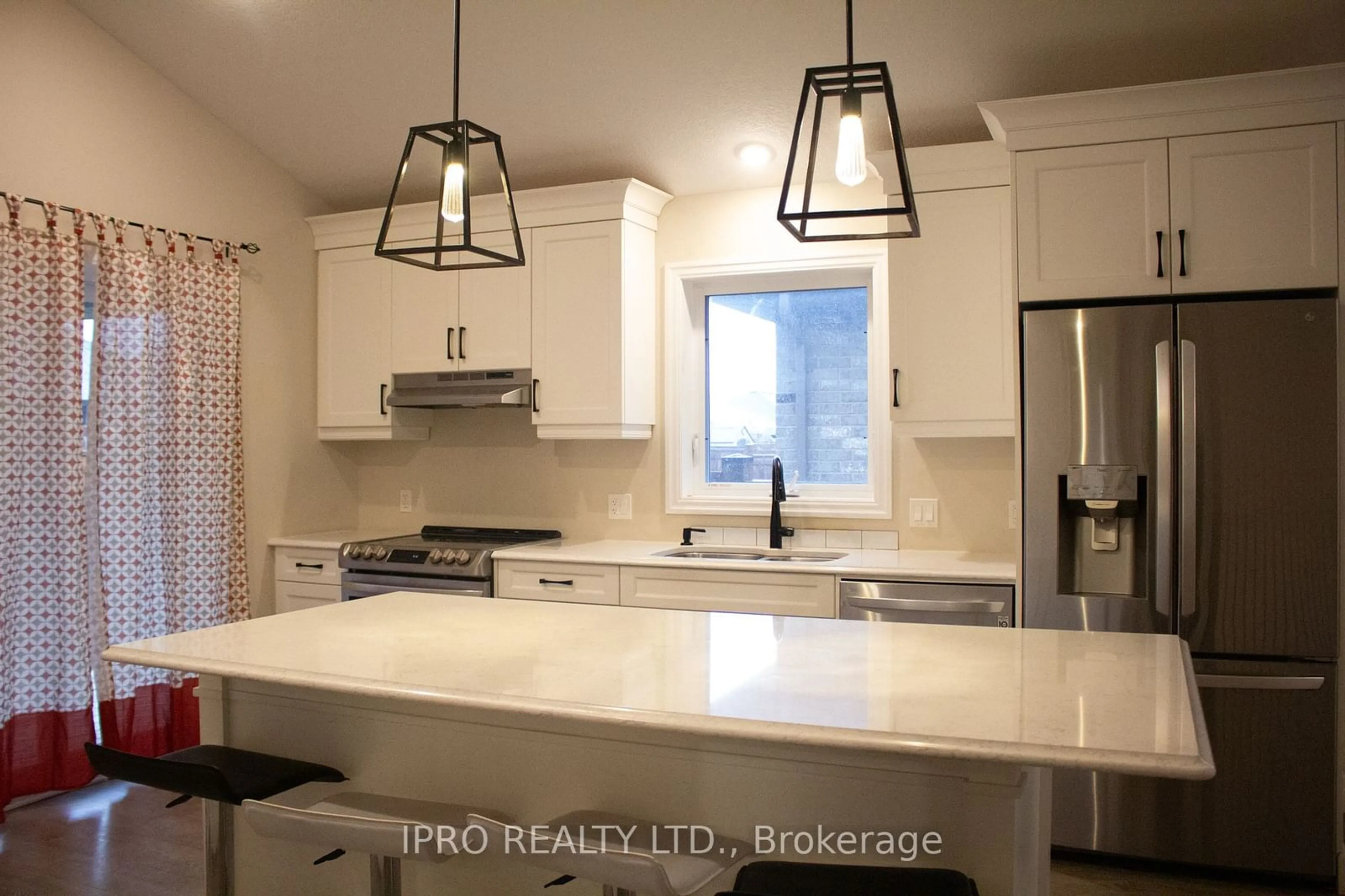 Open concept kitchen for 32 Ambrosia Path, St. Thomas Ontario N5R 0J8