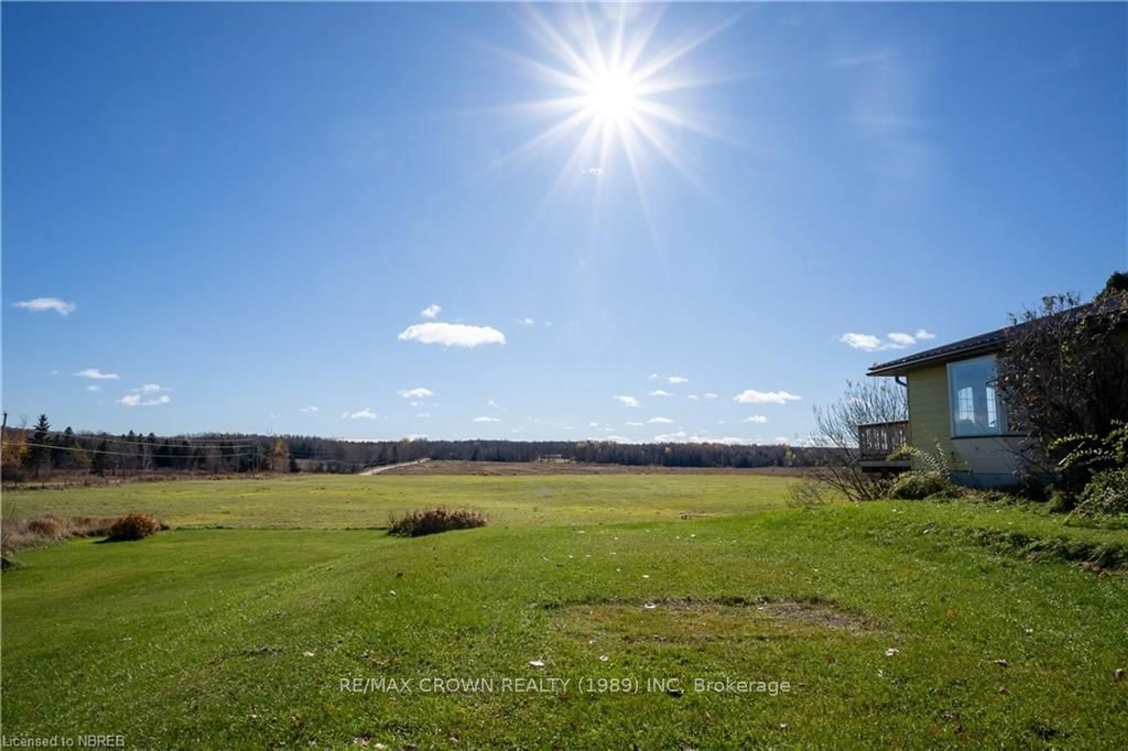 A pic from exterior of the house or condo, the fenced backyard for 537 FARMERS Line, Bonfield Ontario P0H 2E0