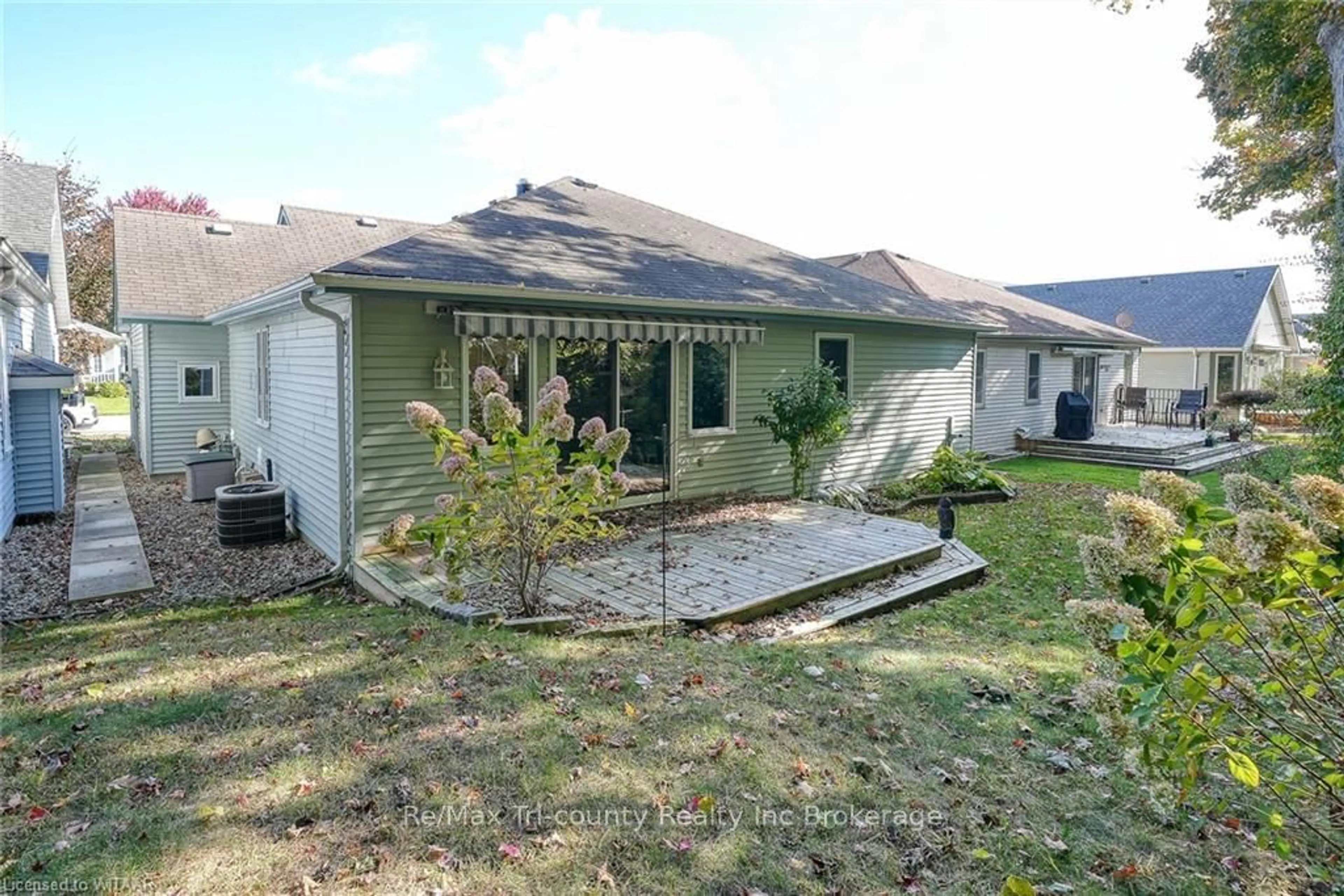 Frontside or backside of a home, the fenced backyard for 18 WILKINS Cres, Tillsonburg Ontario N4G 5M6