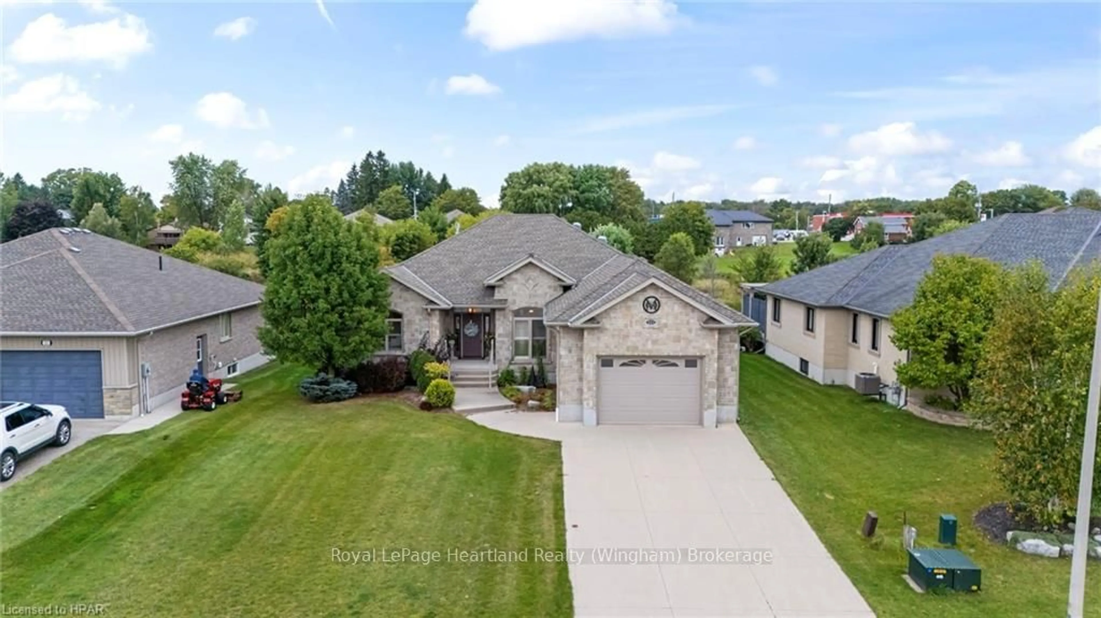 Frontside or backside of a home, the street view for 221 JOHN St, Minto Ontario N0G 1Z0