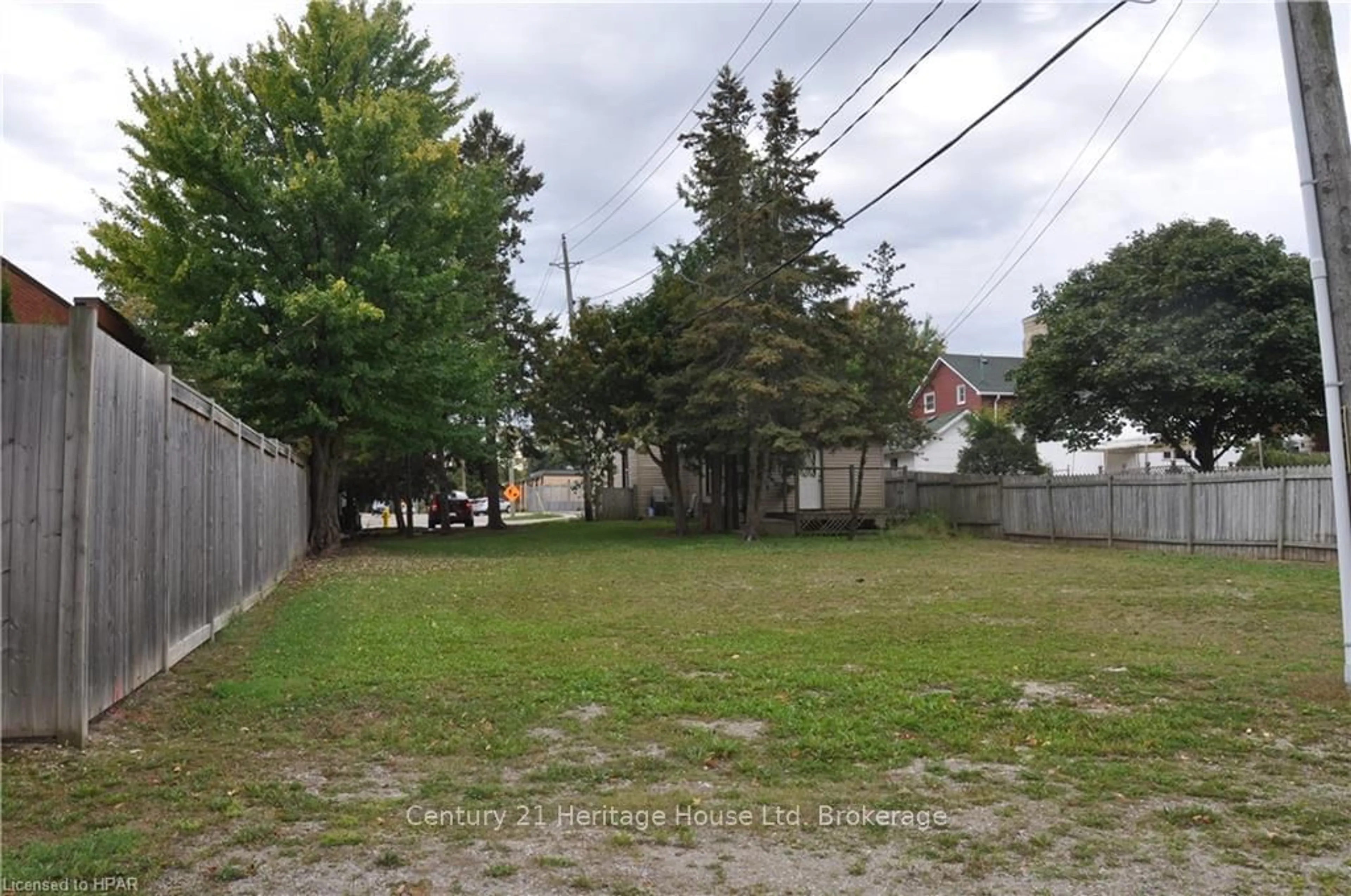 Frontside or backside of a home, the fenced backyard for 50 GODERICH St, Huron East Ontario N0K 1W0