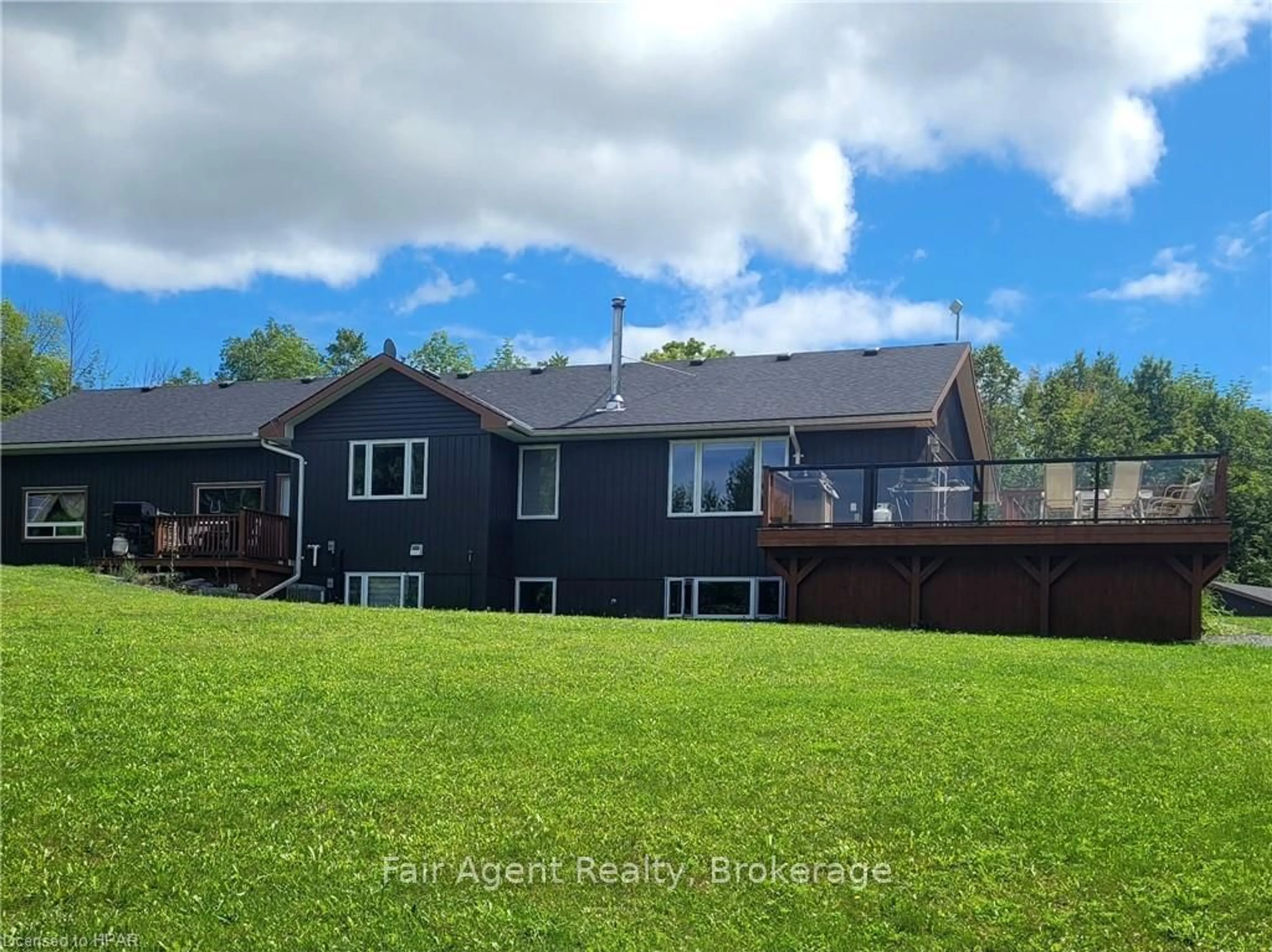 Frontside or backside of a home, the fenced backyard for 425A COLDWATER Rd, Tweed Ontario K0K 2L0