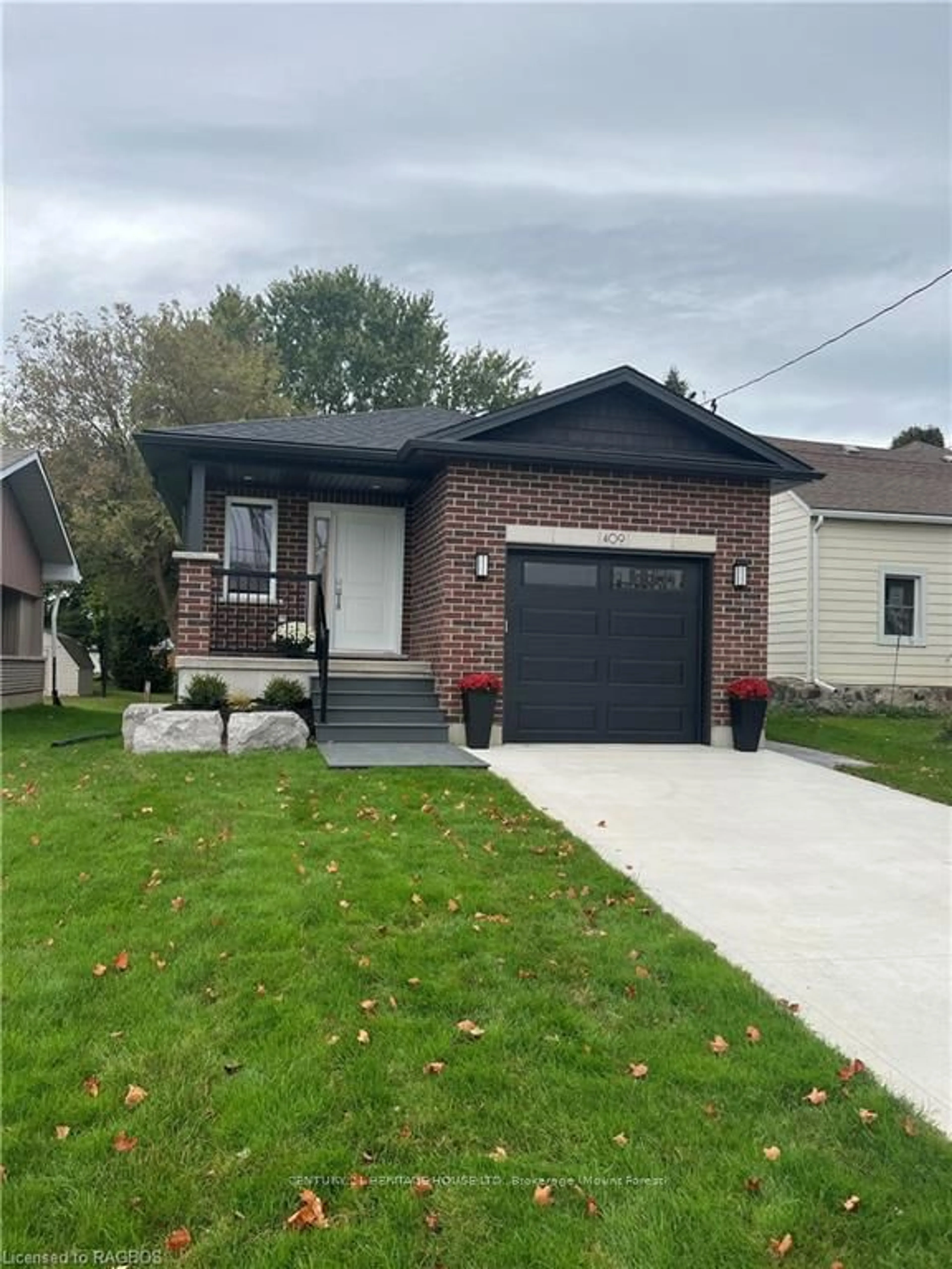 Home with brick exterior material for 409 DURHAM St, Wellington North Ontario N0G 2L1