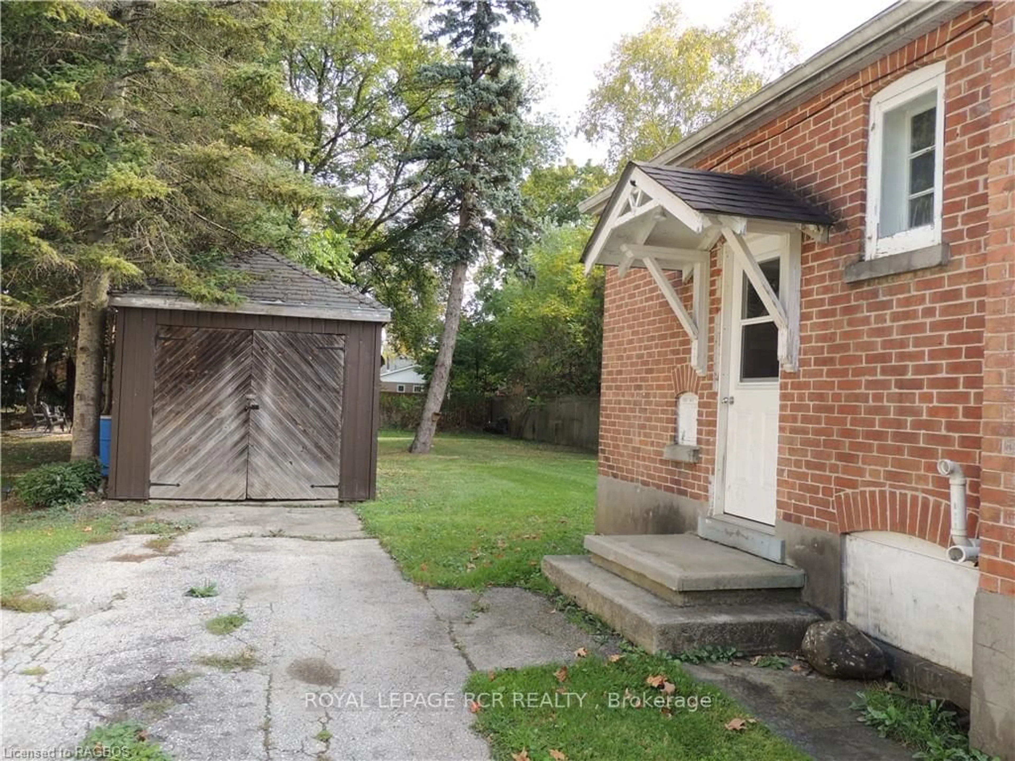 Frontside or backside of a home, the fenced backyard for 151 COUNTESS St, West Grey Ontario N0G 1R0