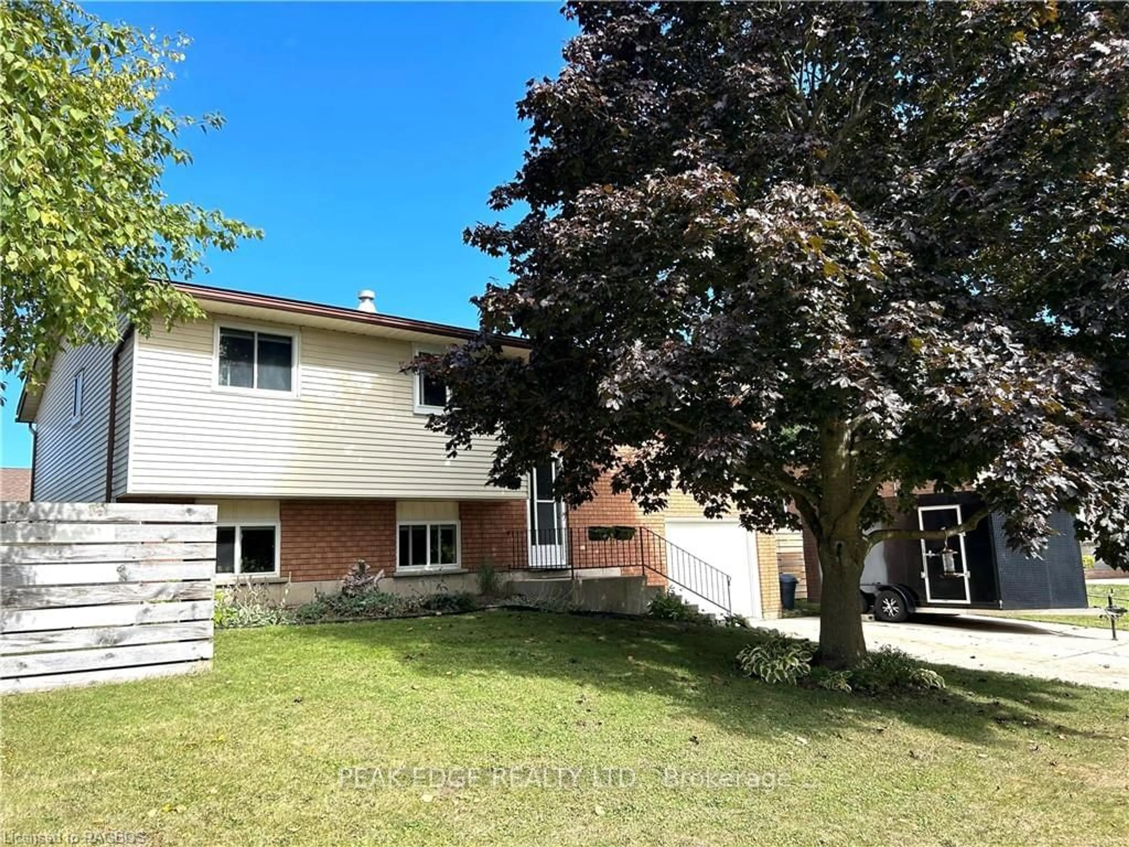 Frontside or backside of a home, the fenced backyard for 390 GEORGE St, West Grey Ontario N0G 1R0