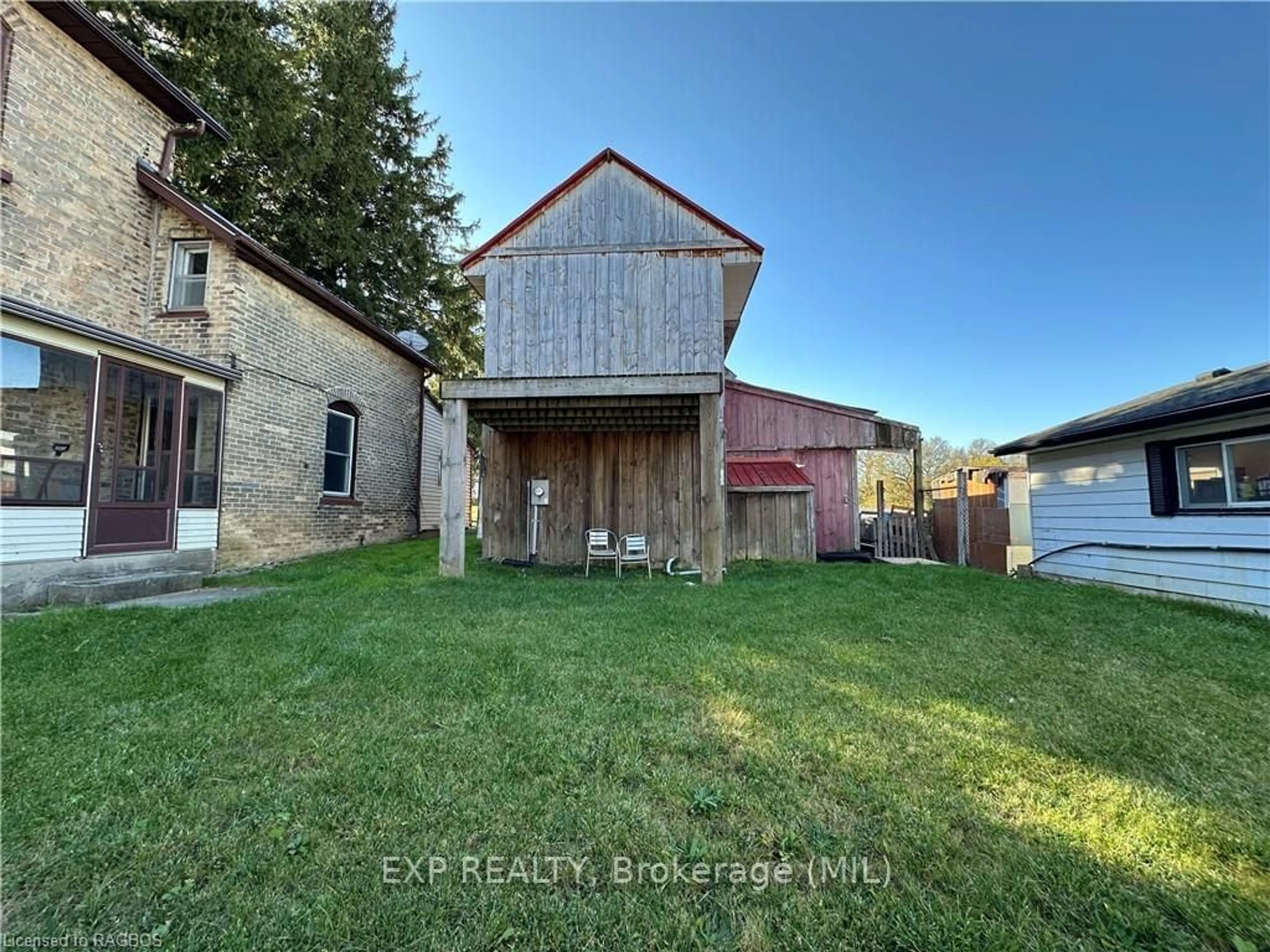 Frontside or backside of a home, the fenced backyard for 95 ELORA St, South Bruce Ontario N0G 2J0