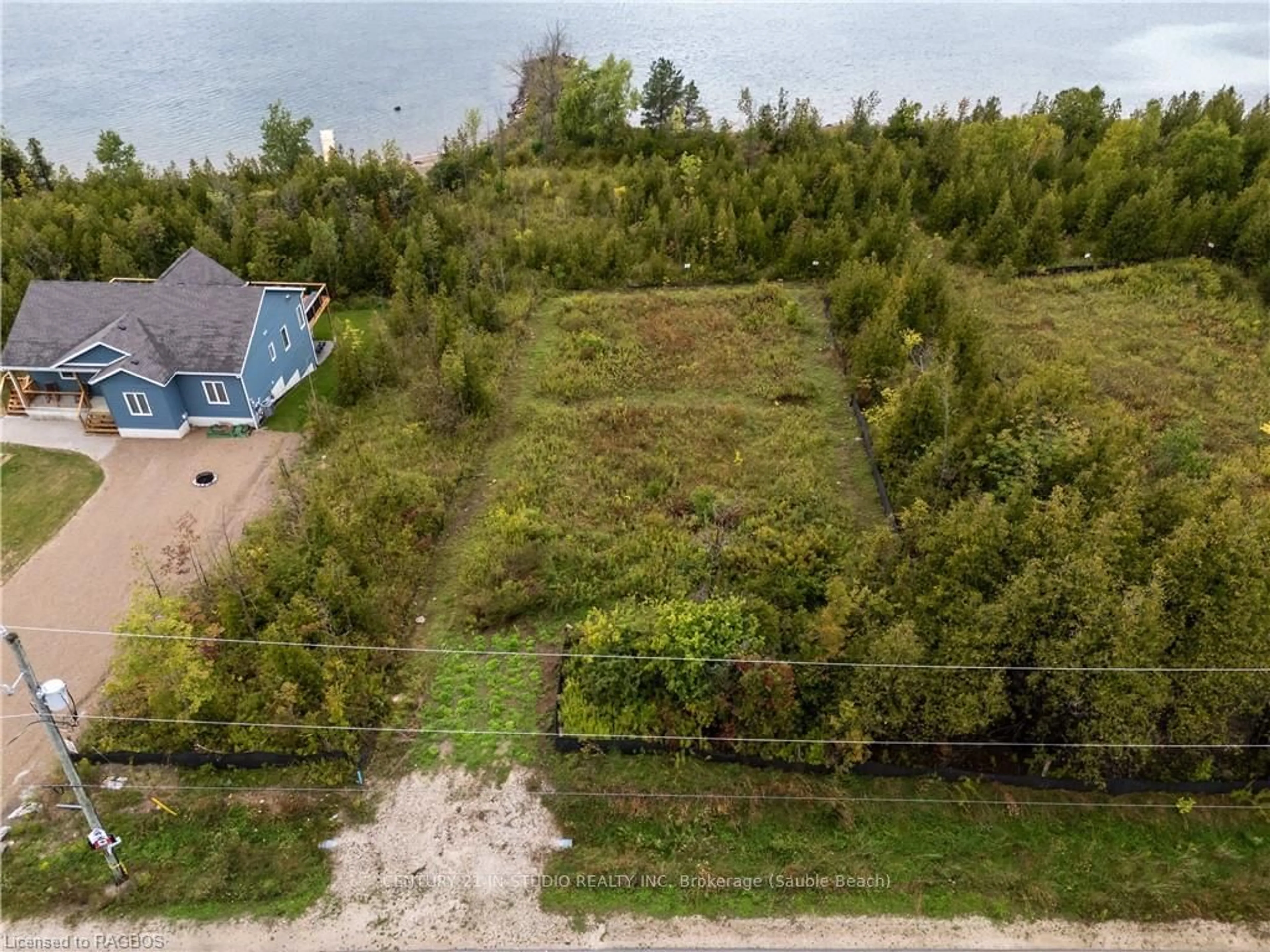 Frontside or backside of a home, the fenced backyard for 151 WILSON DRIVE, Georgian Bluffs Ontario N0H 2T0