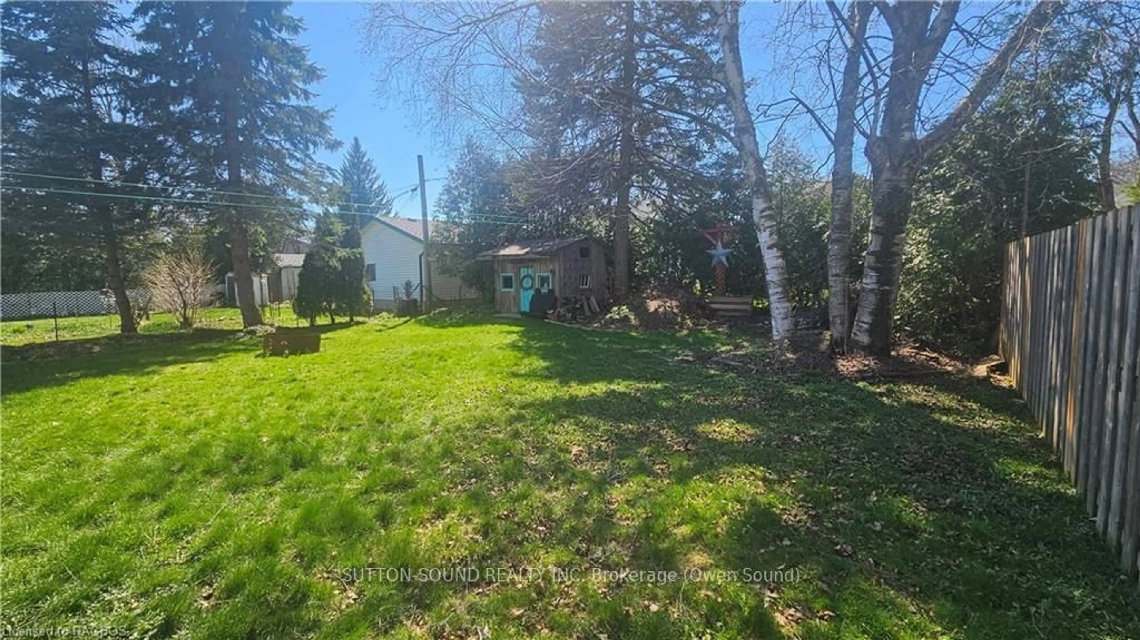 Frontside or backside of a home, the fenced backyard for 868 4TH, Owen Sound Ontario N4K 2N7