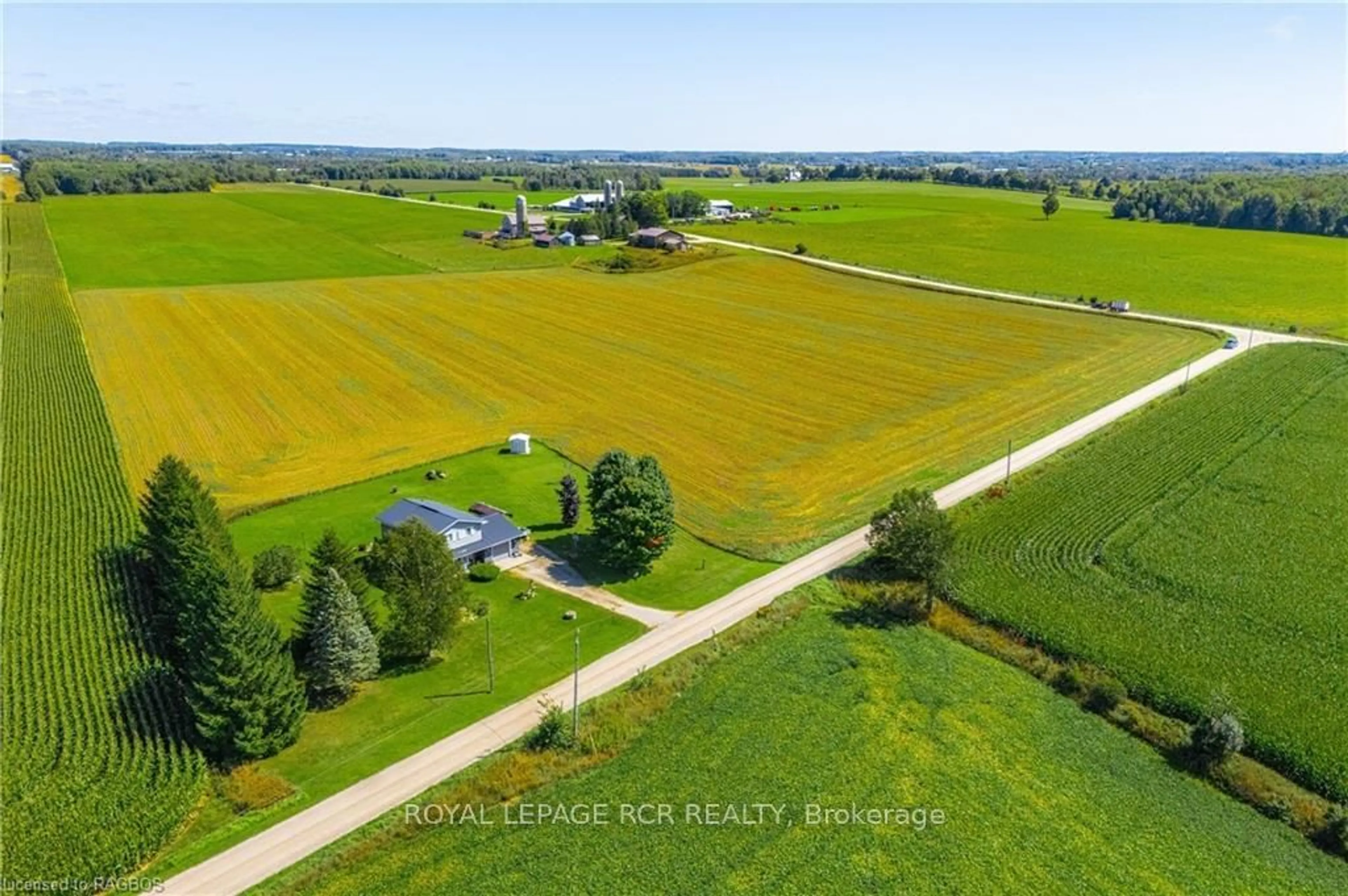 A pic from exterior of the house or condo, the fenced backyard for 331527 SOUTHGATE SIDEROAD 33, Southgate Ontario N0G 2L0