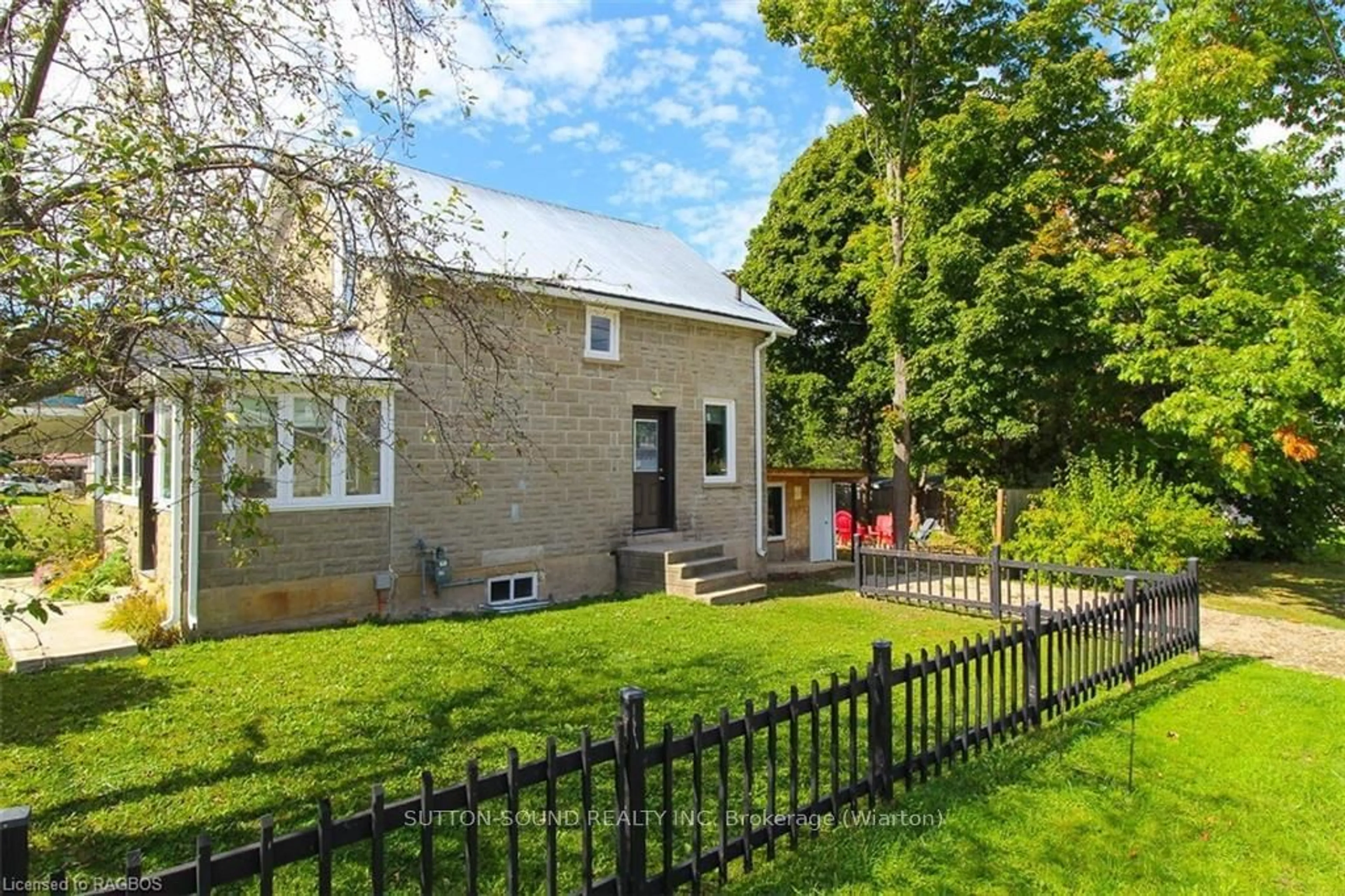 A pic from exterior of the house or condo, the fenced backyard for 514 FRANK St, South Bruce Peninsula Ontario N0H 2T0