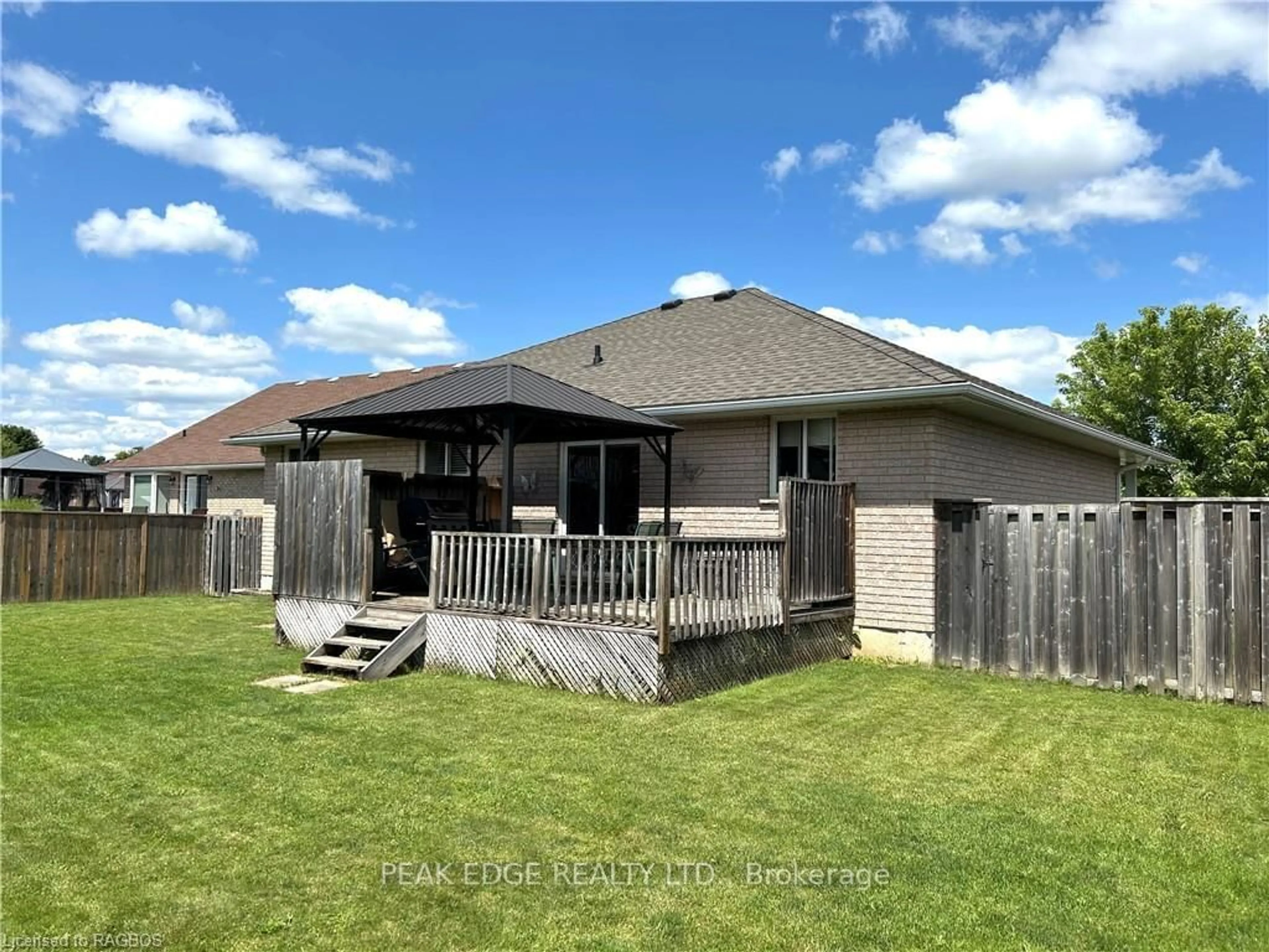 Frontside or backside of a home, the fenced backyard for 765 17TH St, Hanover Ontario N4N 3W8