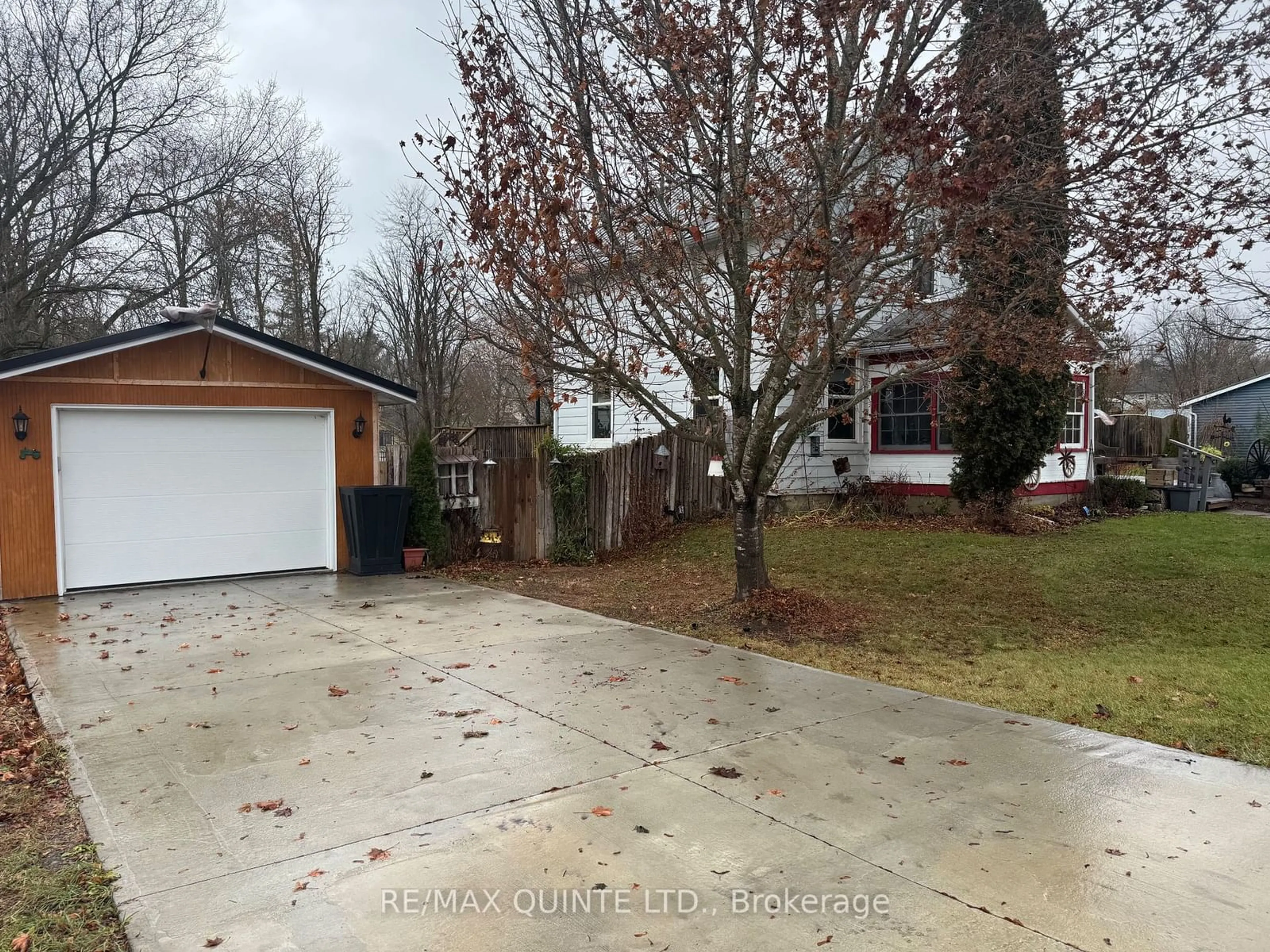 Frontside or backside of a home, the fenced backyard for 22 Wellington St, Centre Hastings Ontario K0K 2K0