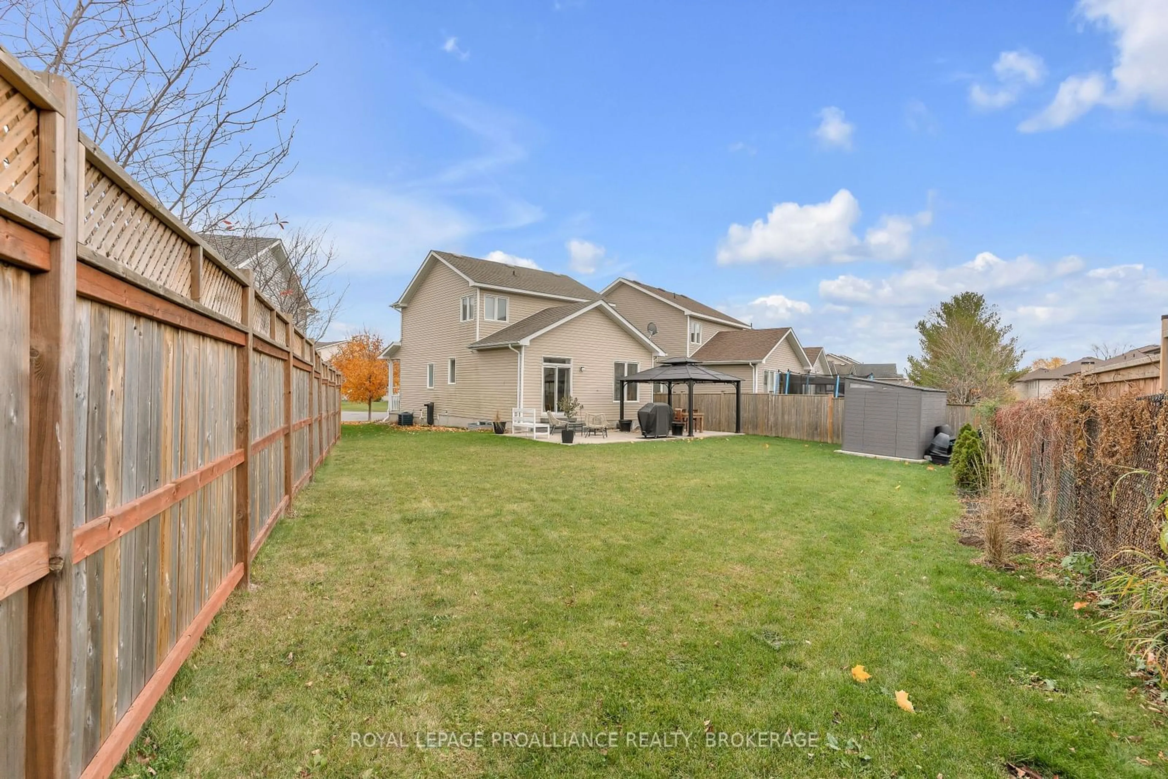 Frontside or backside of a home, the fenced backyard for 1616 Crimson Cres, Kingston Ontario K7P 0J3