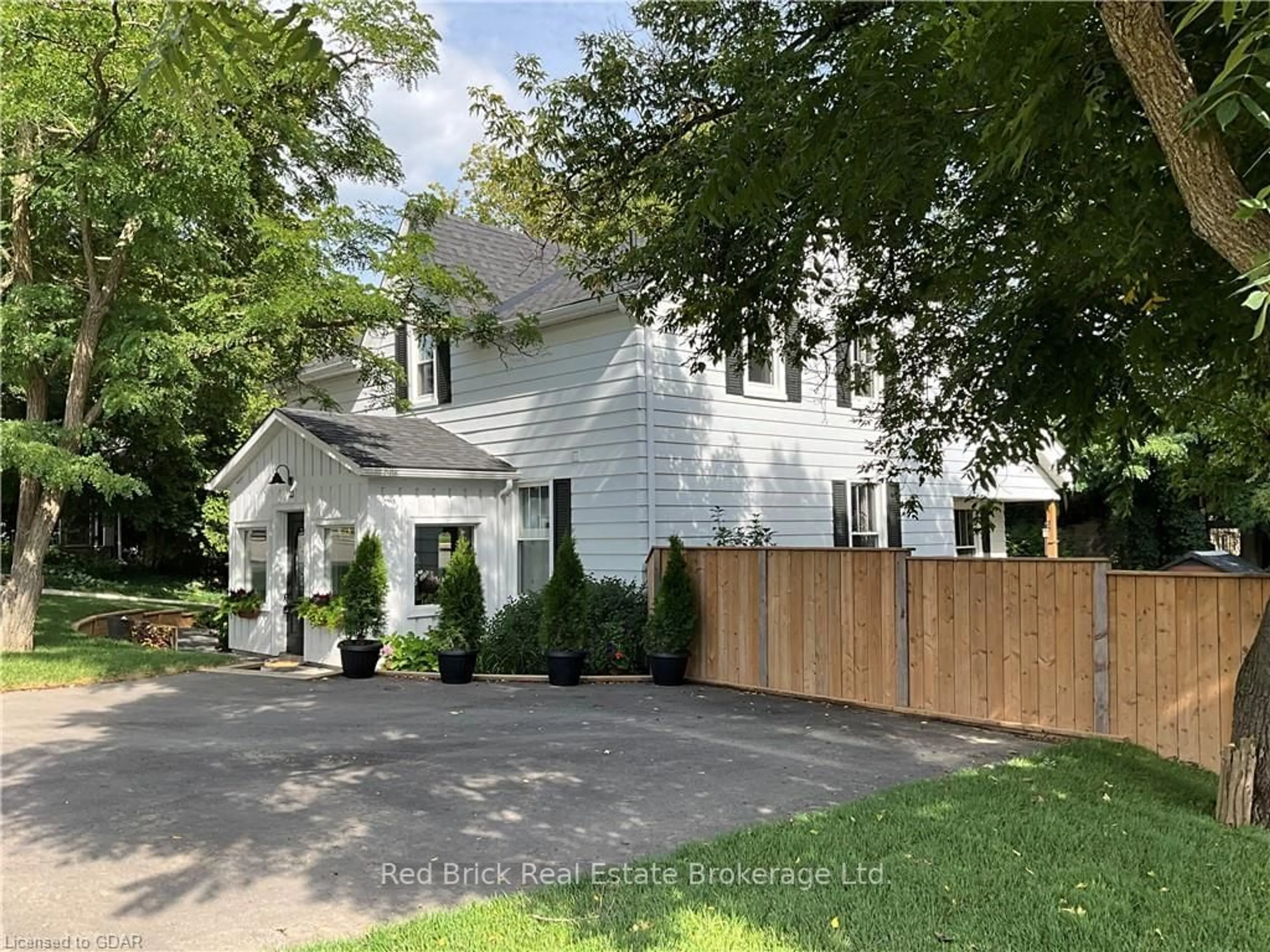 Frontside or backside of a home, the fenced backyard for 23 MILL STREET EAST St, Centre Wellington Ontario N0B 1S0