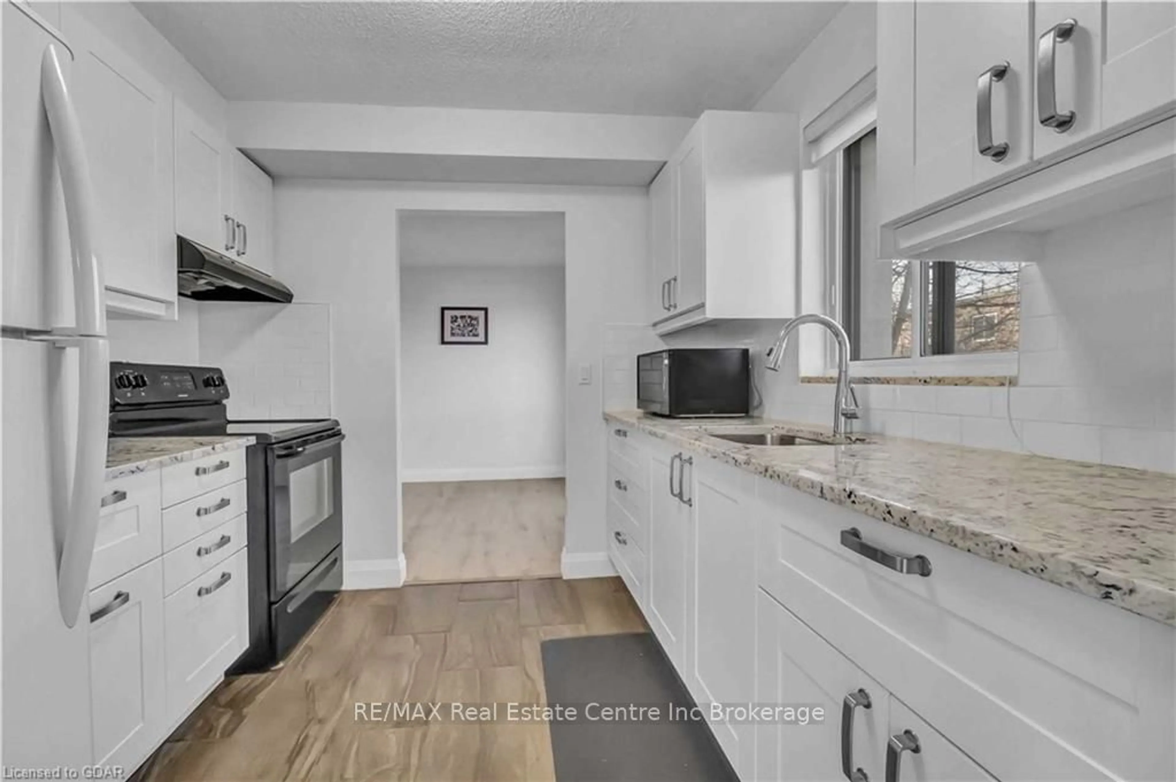 Standard kitchen, wood floors, cottage for 358 WATERLOO Ave #205, Guelph Ontario N1H 7Y3