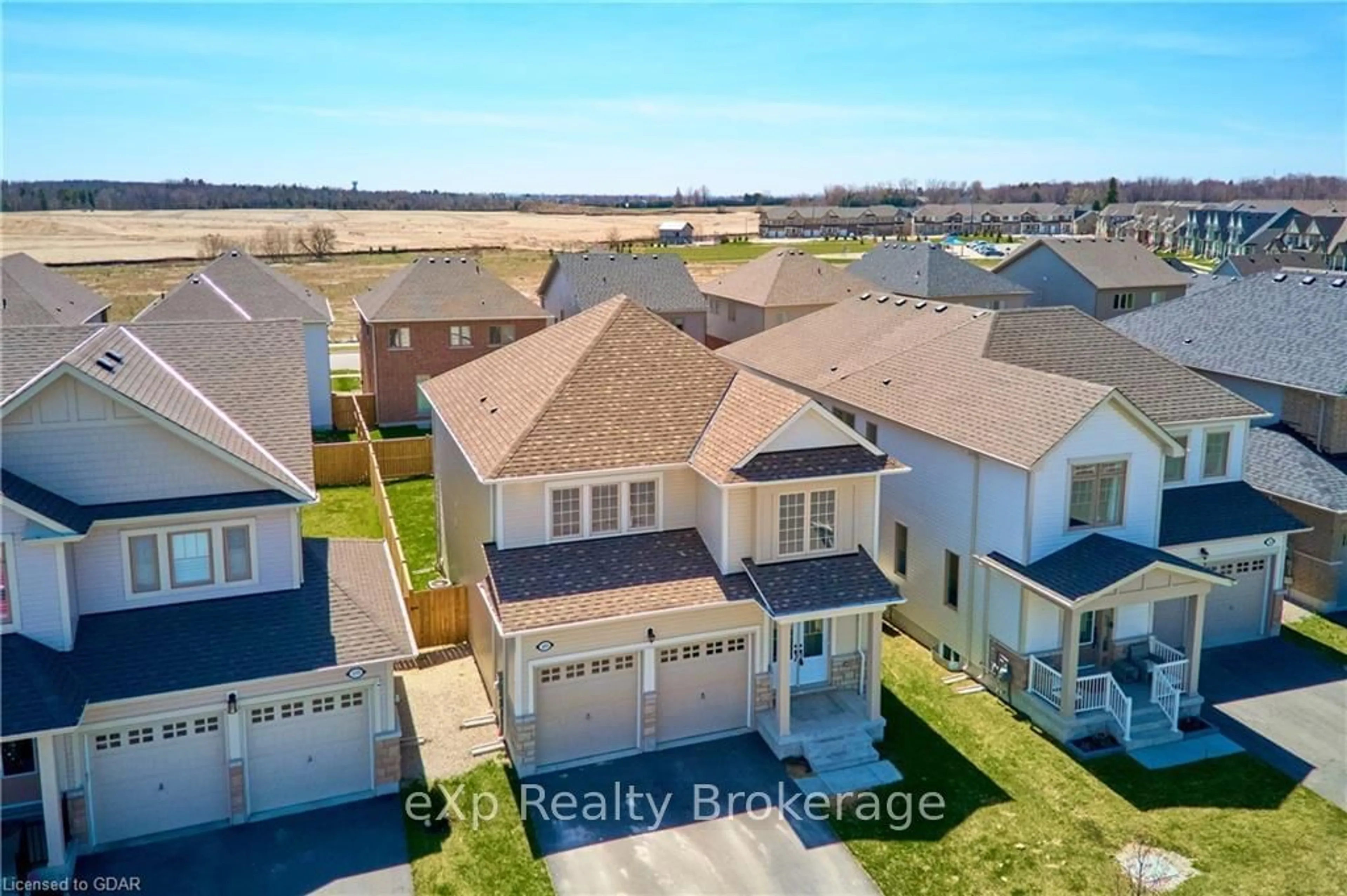 Frontside or backside of a home, the fenced backyard for 149 HARPIN Way, Centre Wellington Ontario N1M 2W3