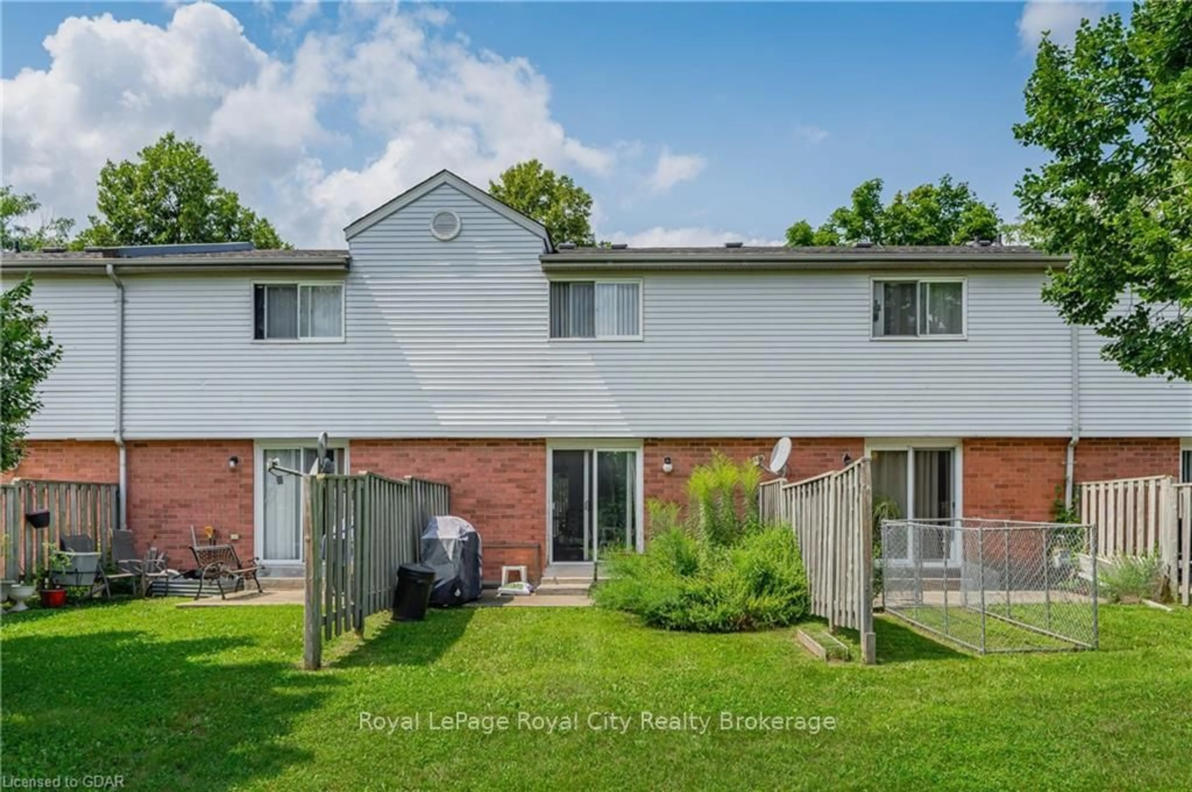 Frontside or backside of a home, the fenced backyard for 40 IMPERIAL Rd #5, Guelph Ontario N1H 8B4