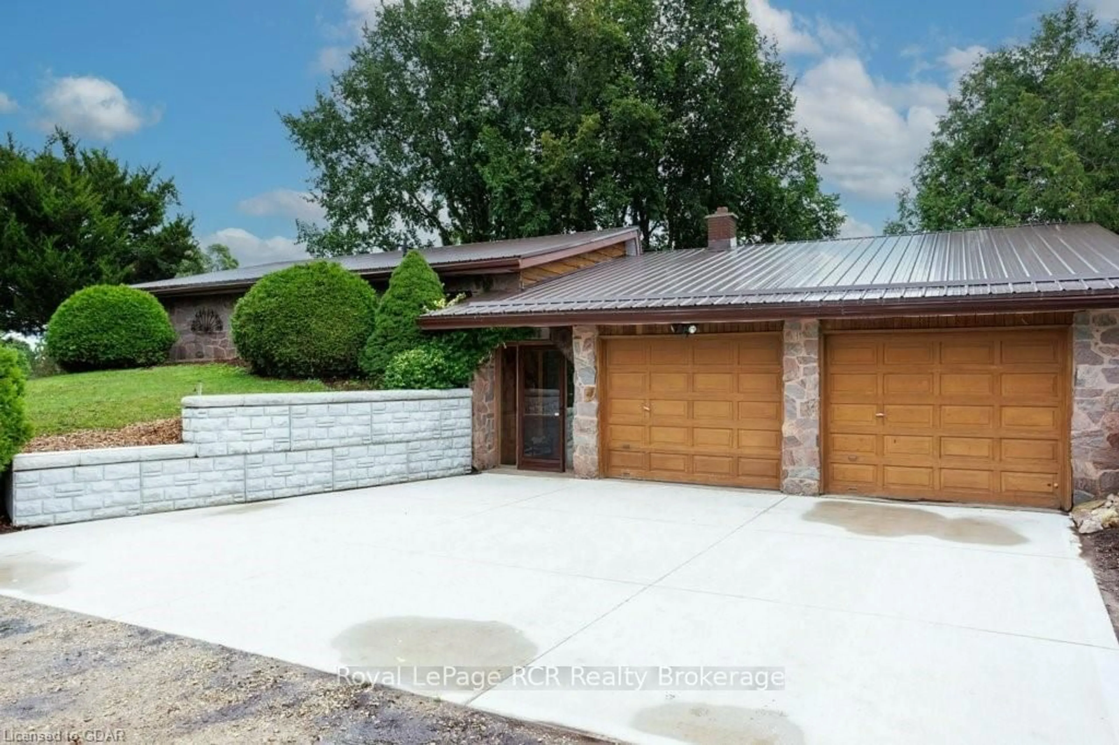 Frontside or backside of a home, the street view for 9811 CREEK Rd, Minto Ontario N0G 1M0