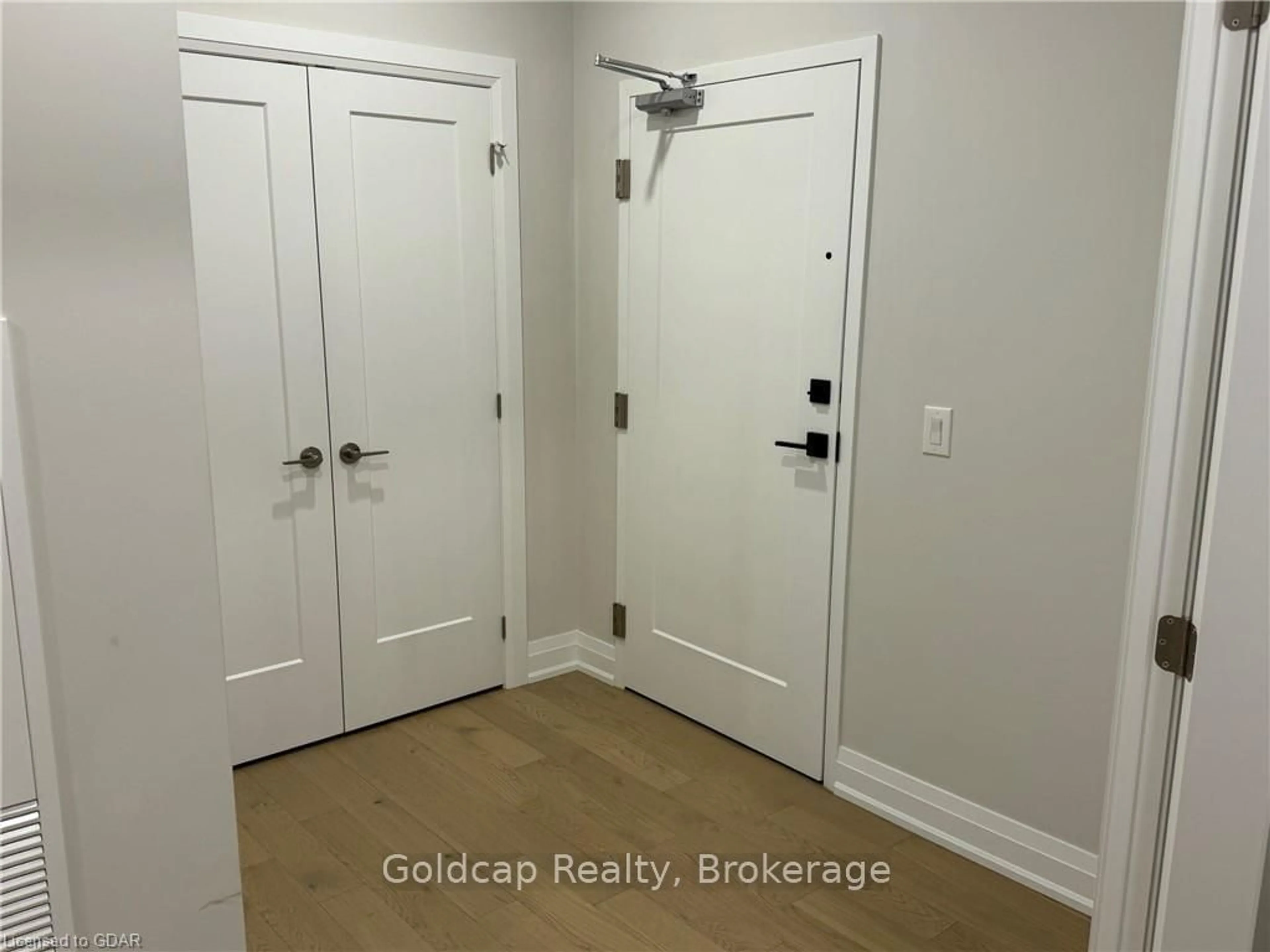 Indoor entryway, wood floors for 71 WYNDHAM St #203, Guelph Ontario N1E 0T7