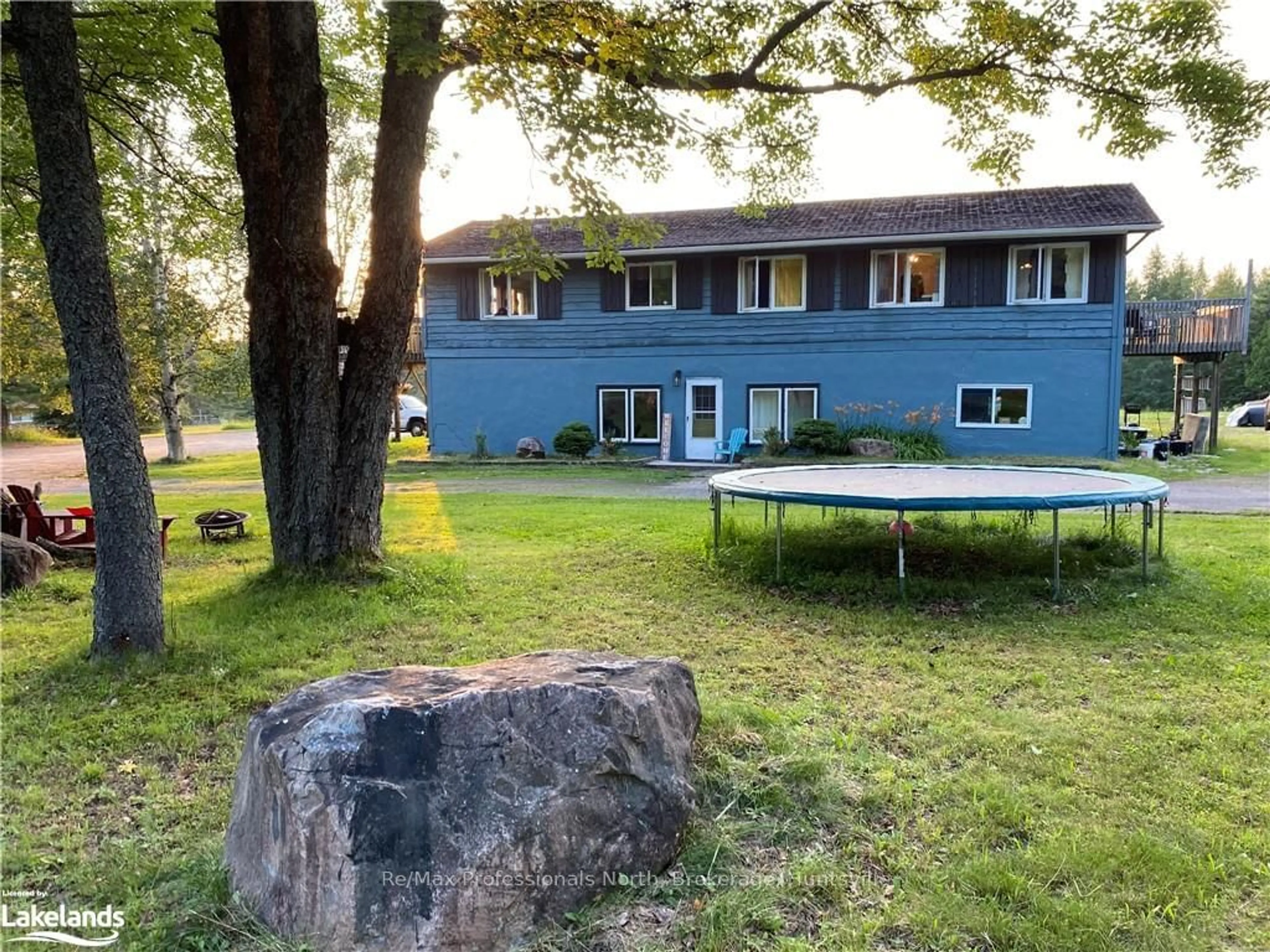 Frontside or backside of a home, the fenced backyard for 204 MINERAL SPRINGS Rd, Huntsville Ontario P1H 2N5