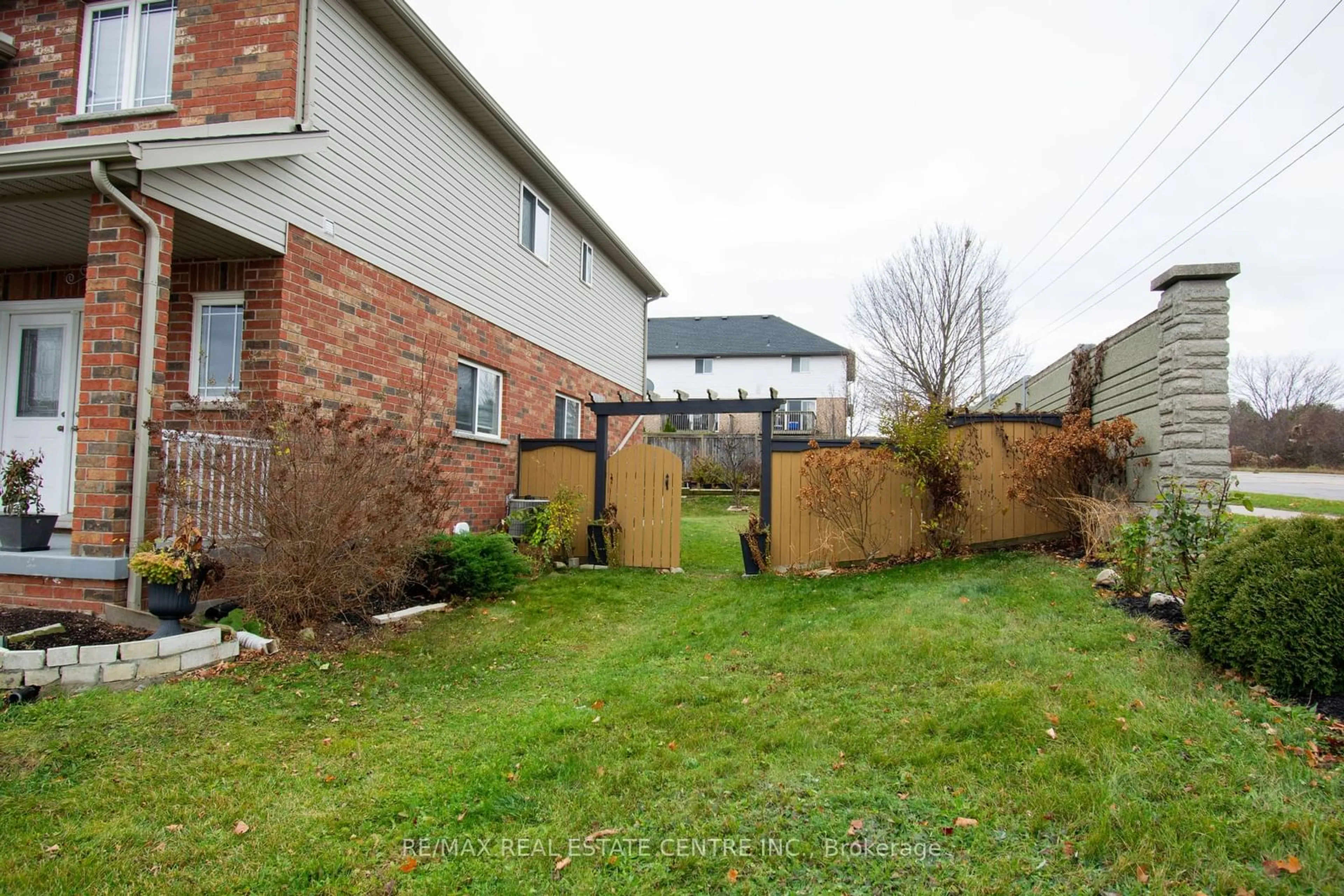 A pic from exterior of the house or condo, the fenced backyard for 1 Colonial Dr, Guelph Ontario N1L 1T7