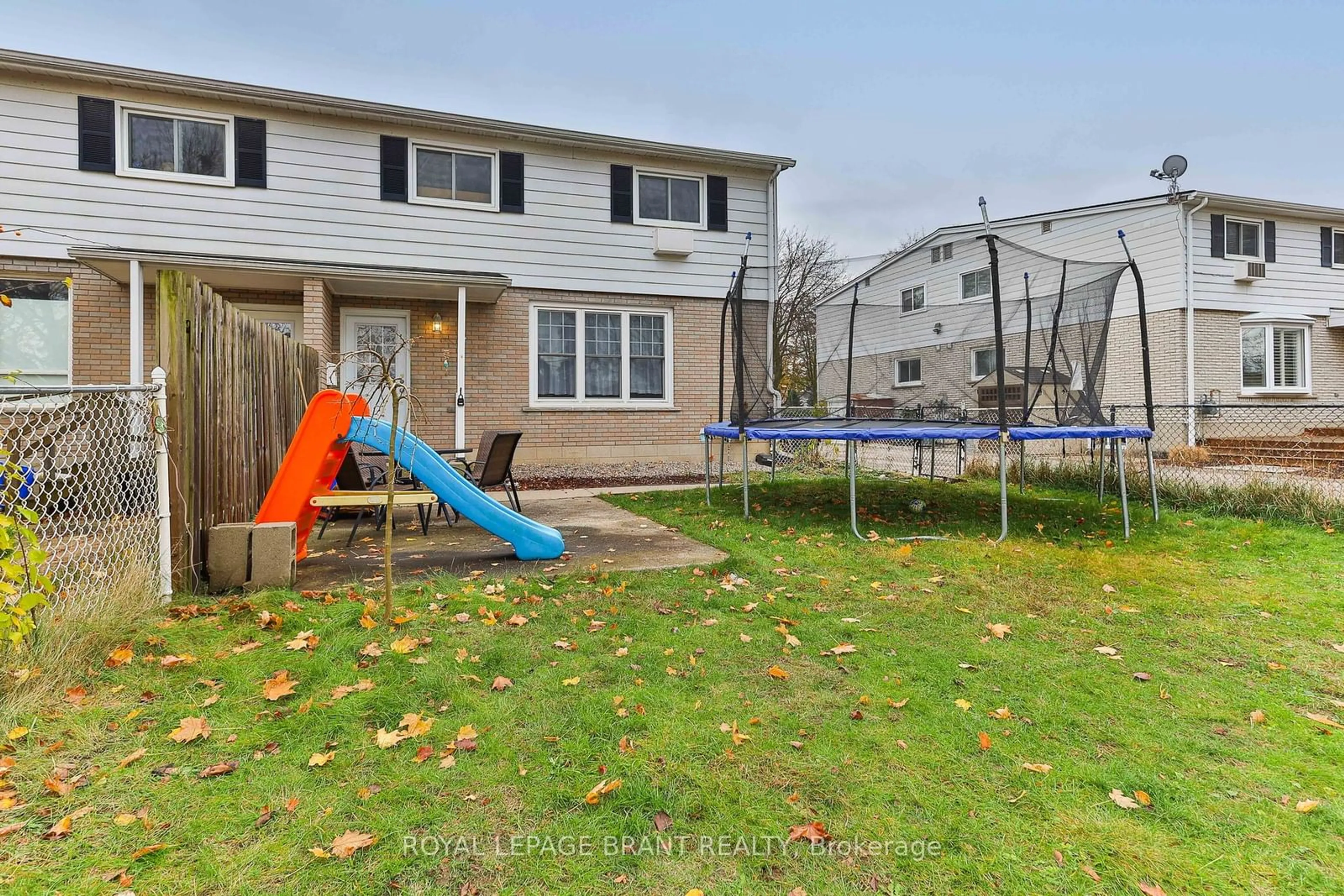 A pic from exterior of the house or condo, the fenced backyard for 43 Metcalfe Cres #C, Brantford Ontario N3R 2L7