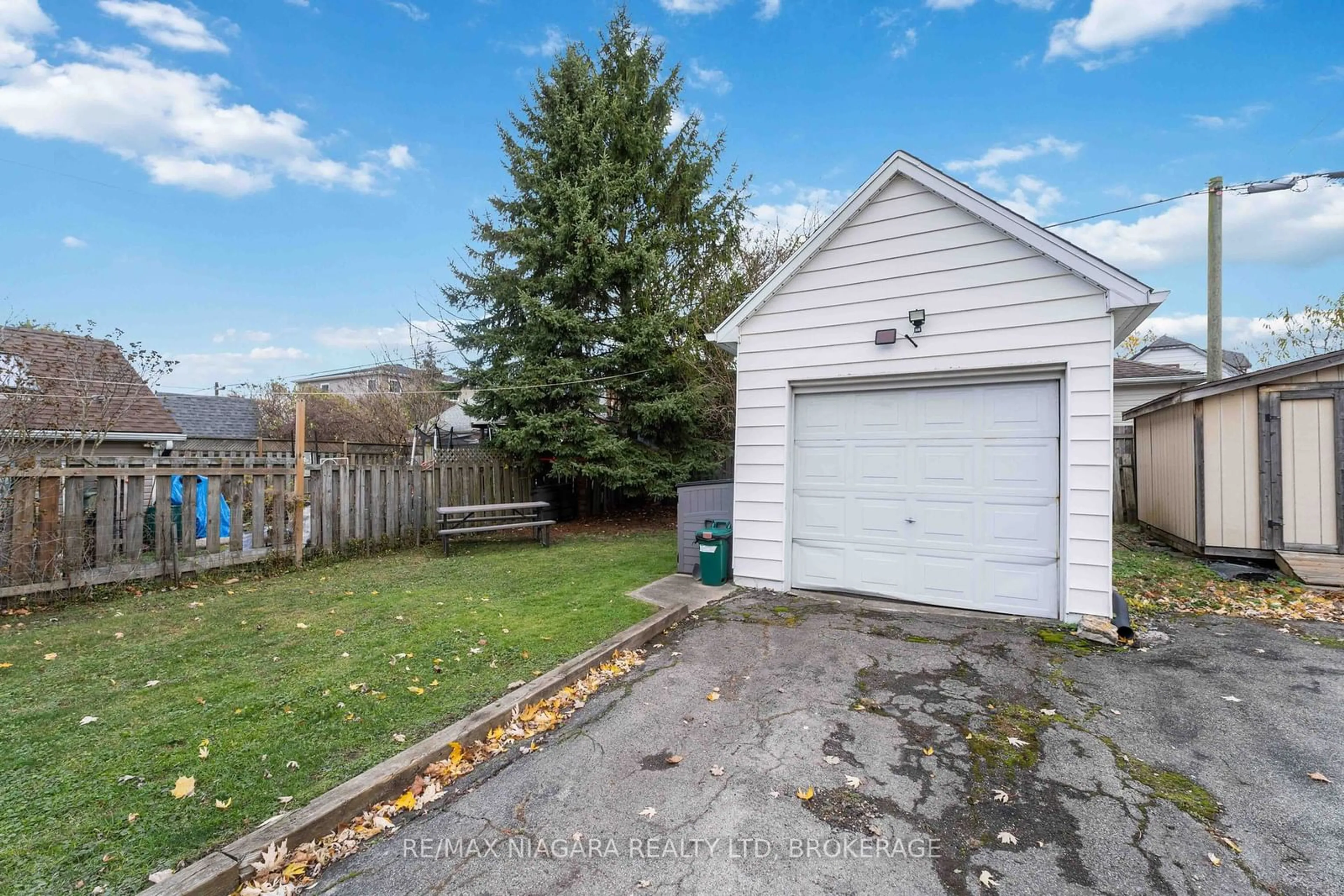 Frontside or backside of a home, the fenced backyard for 433 Davis St, Port Colborne Ontario L3K 1Z7