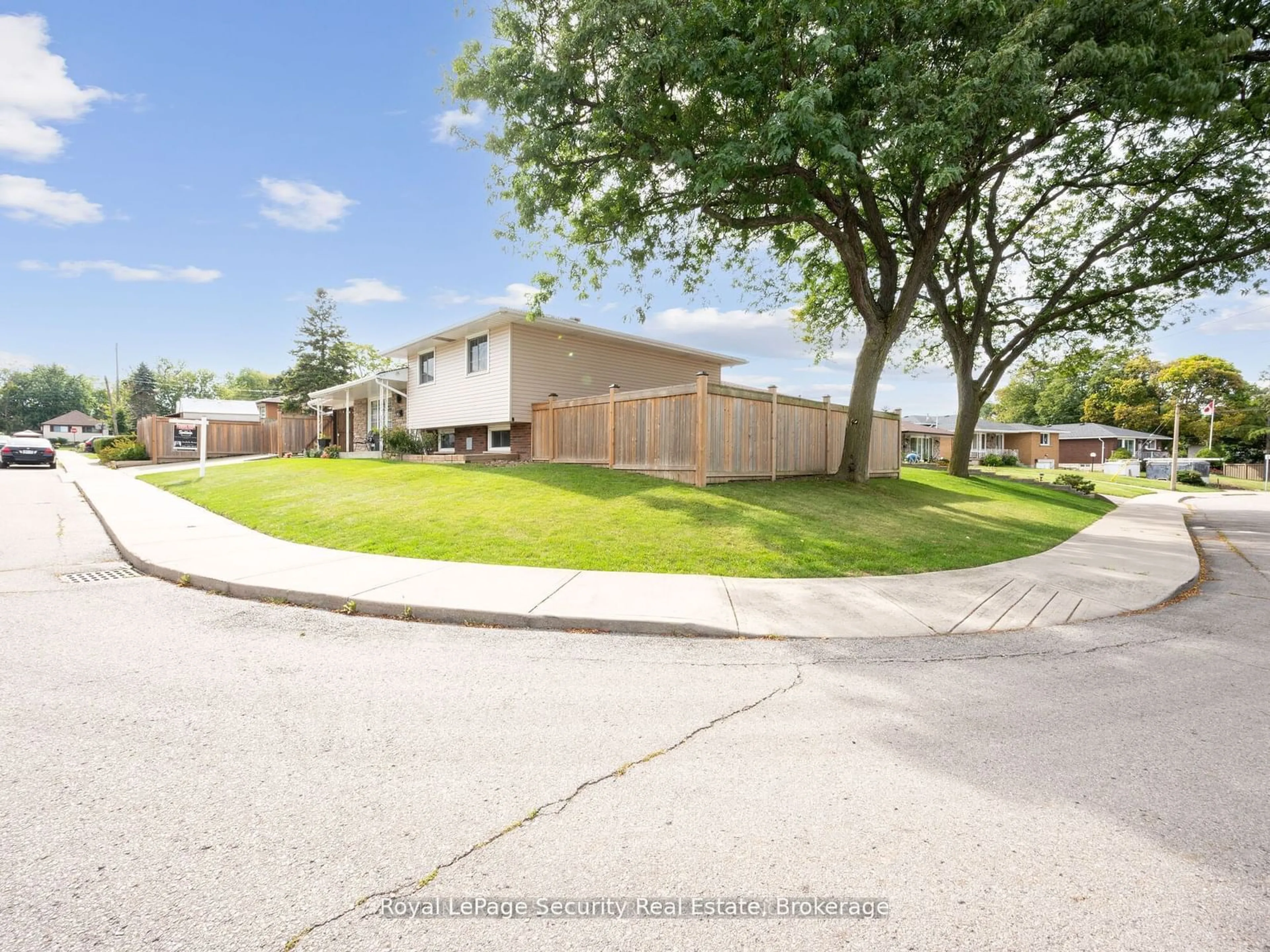 A pic from exterior of the house or condo, the fenced backyard for 2 Maitland Ave, Hamilton Ontario L9A 3J3