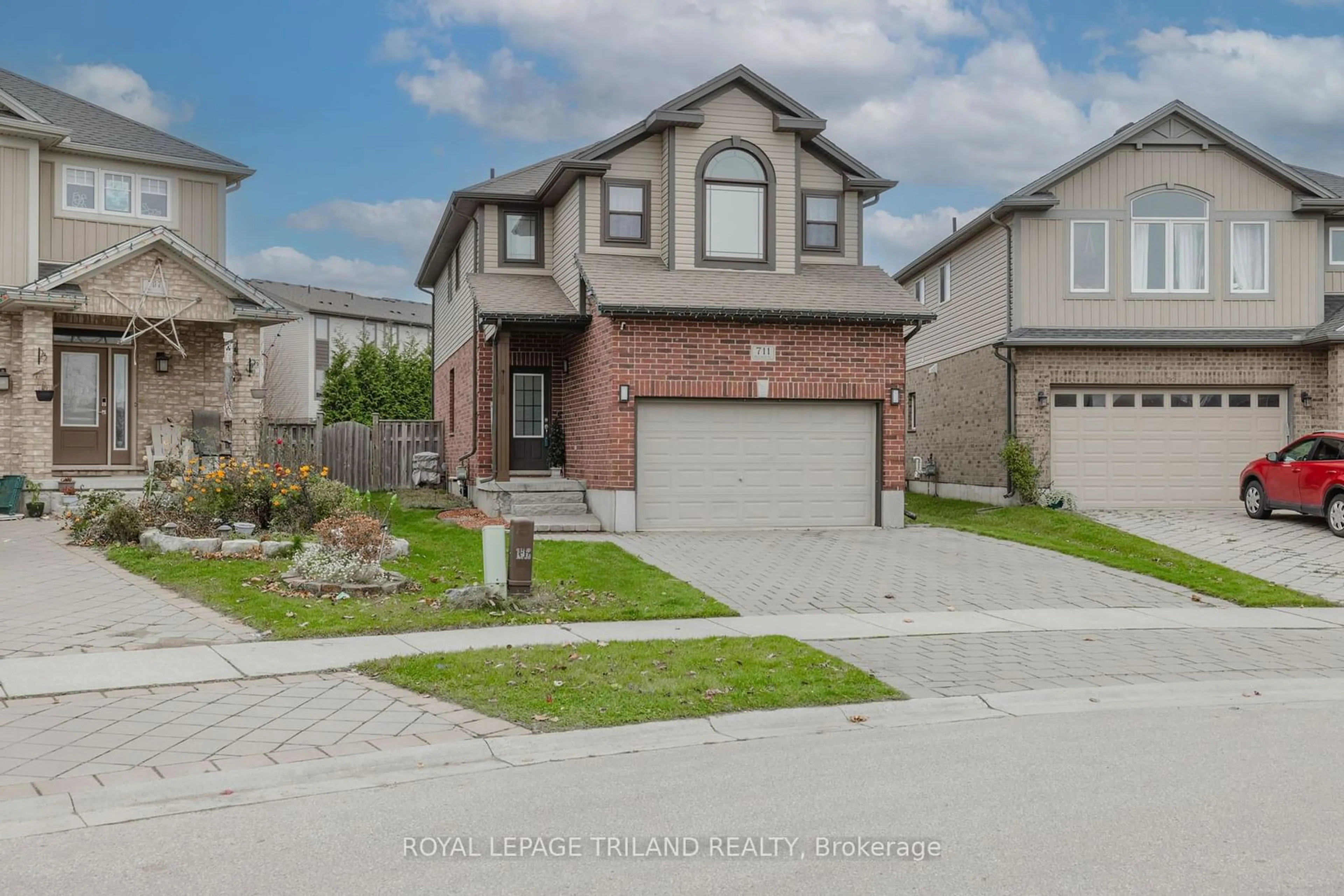 Frontside or backside of a home, the street view for 711 Springwood Cres, London Ontario N6G 0H8