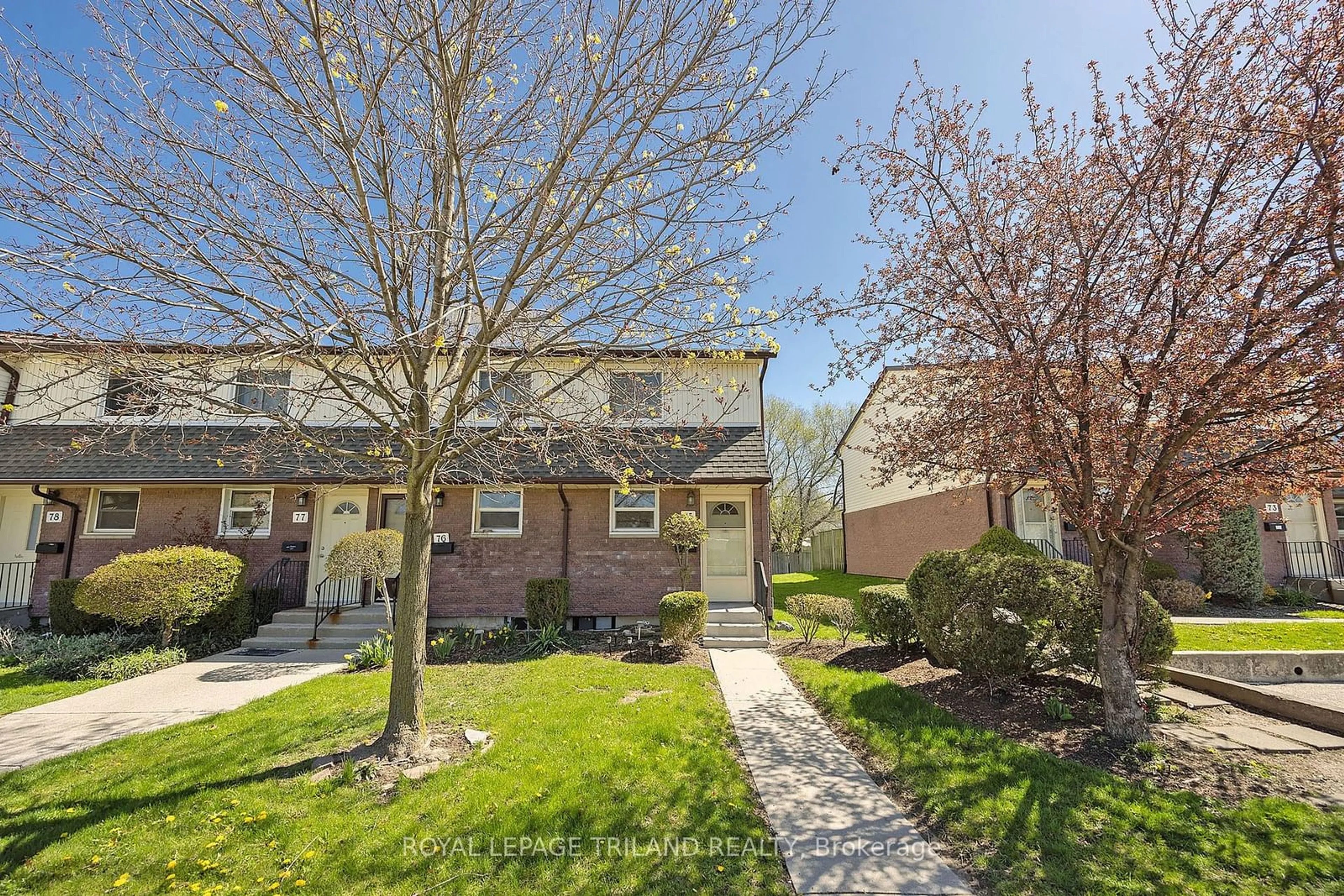 A pic from exterior of the house or condo, the fenced backyard for 1919 Trafalgar St #75, London Ontario N5V 1A1