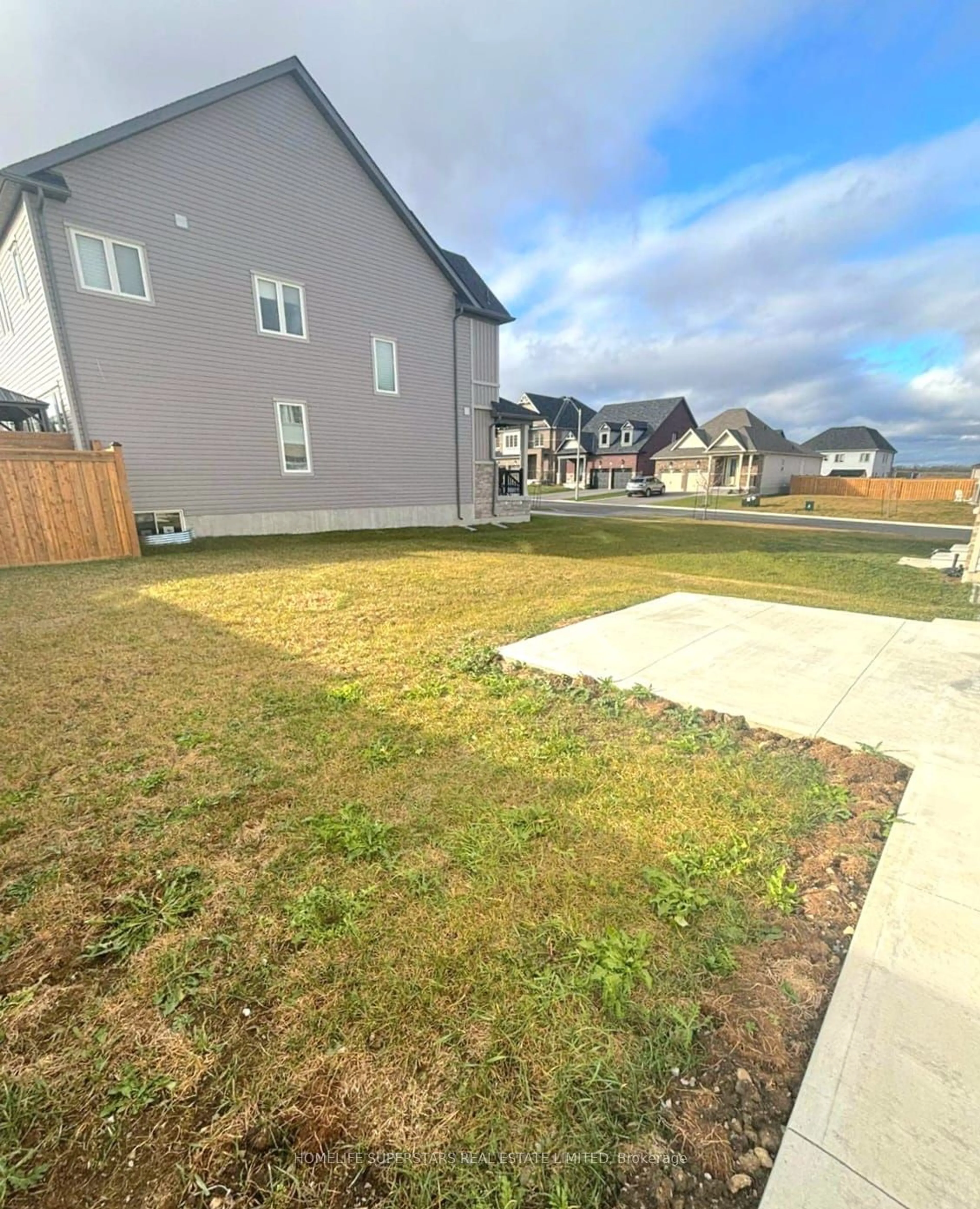 Frontside or backside of a home, the fenced backyard for 9 Hennessey Cres, Kawartha Lakes Ontario K9V 0P2