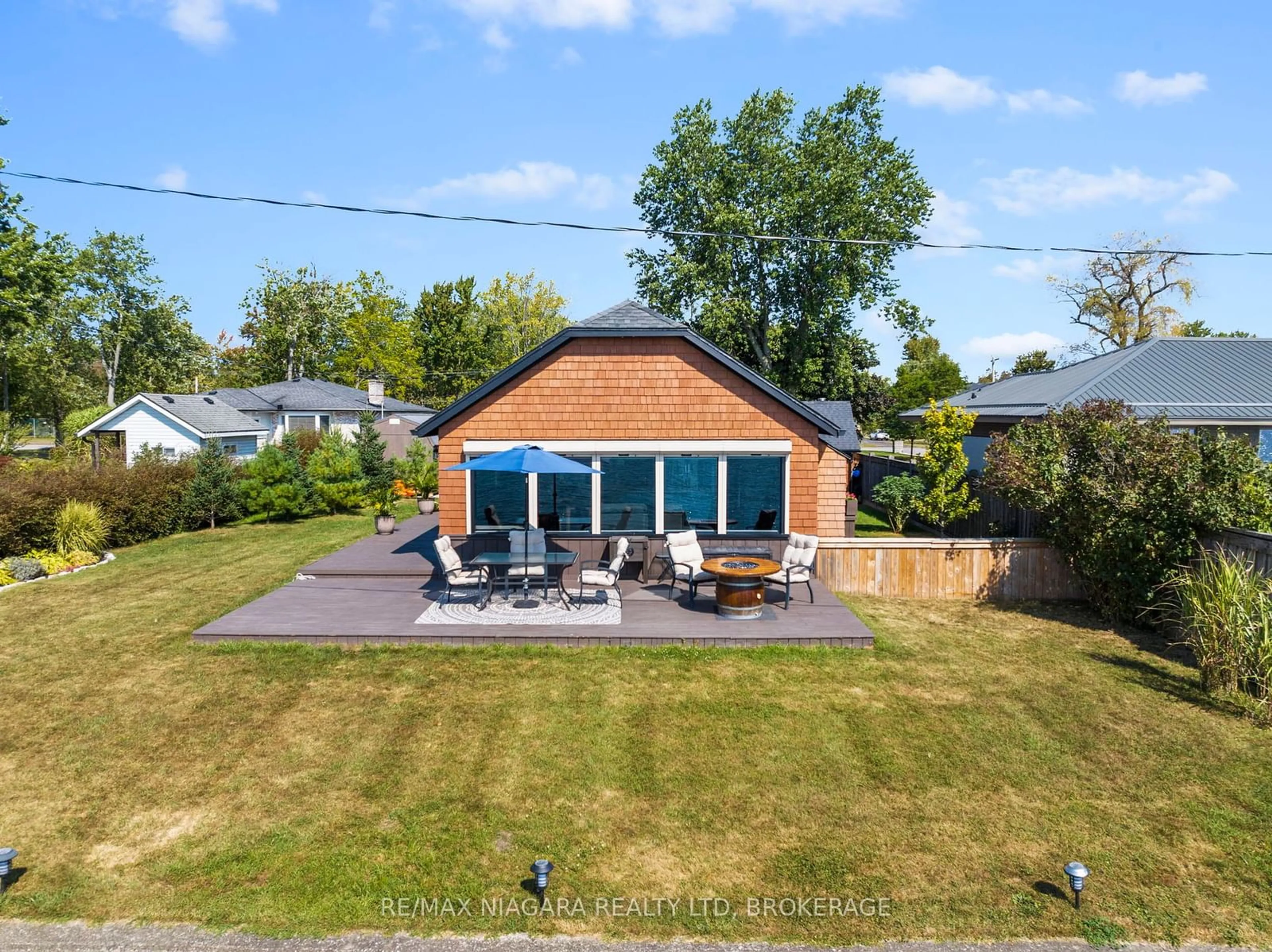 Frontside or backside of a home, the fenced backyard for 10959 Lakeshore Rd, Wainfleet Ontario L3K 5V4