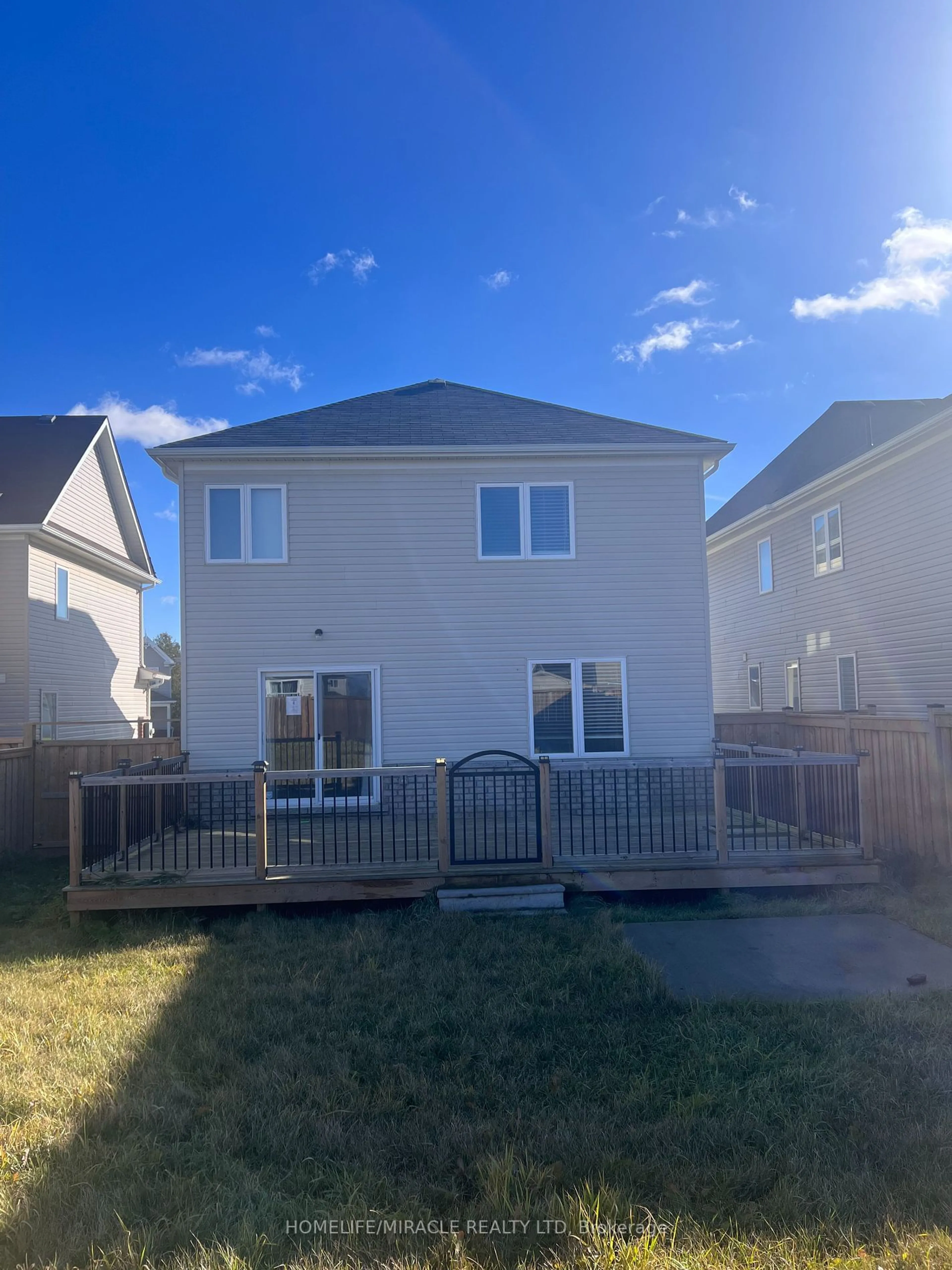 Frontside or backside of a home, the fenced backyard for 90 Todd Cres, Southgate Ontario N0C 1B0