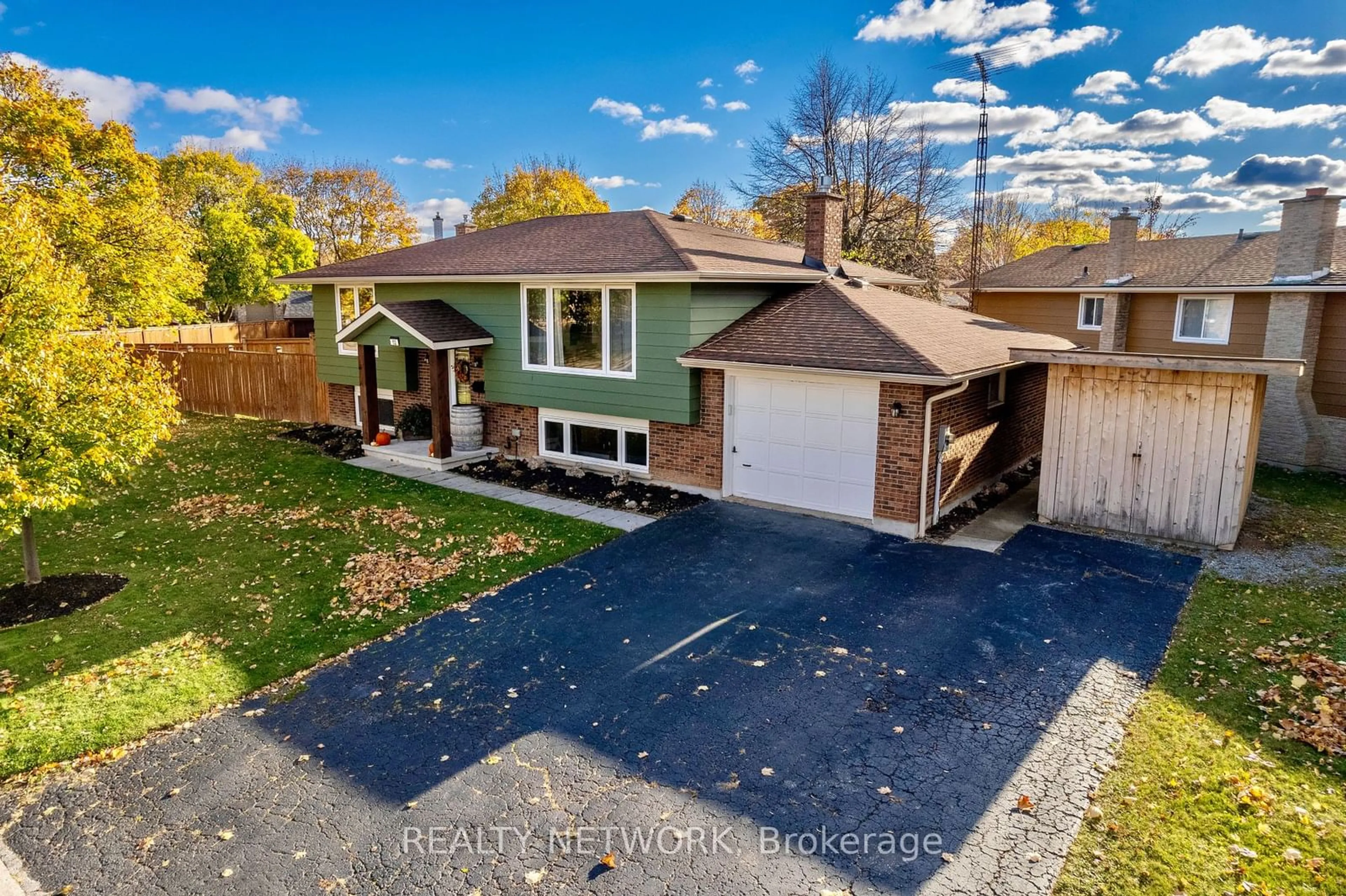 Frontside or backside of a home, the fenced backyard for 12 Dwyer St, St. Catharines Ontario L2M 7G1