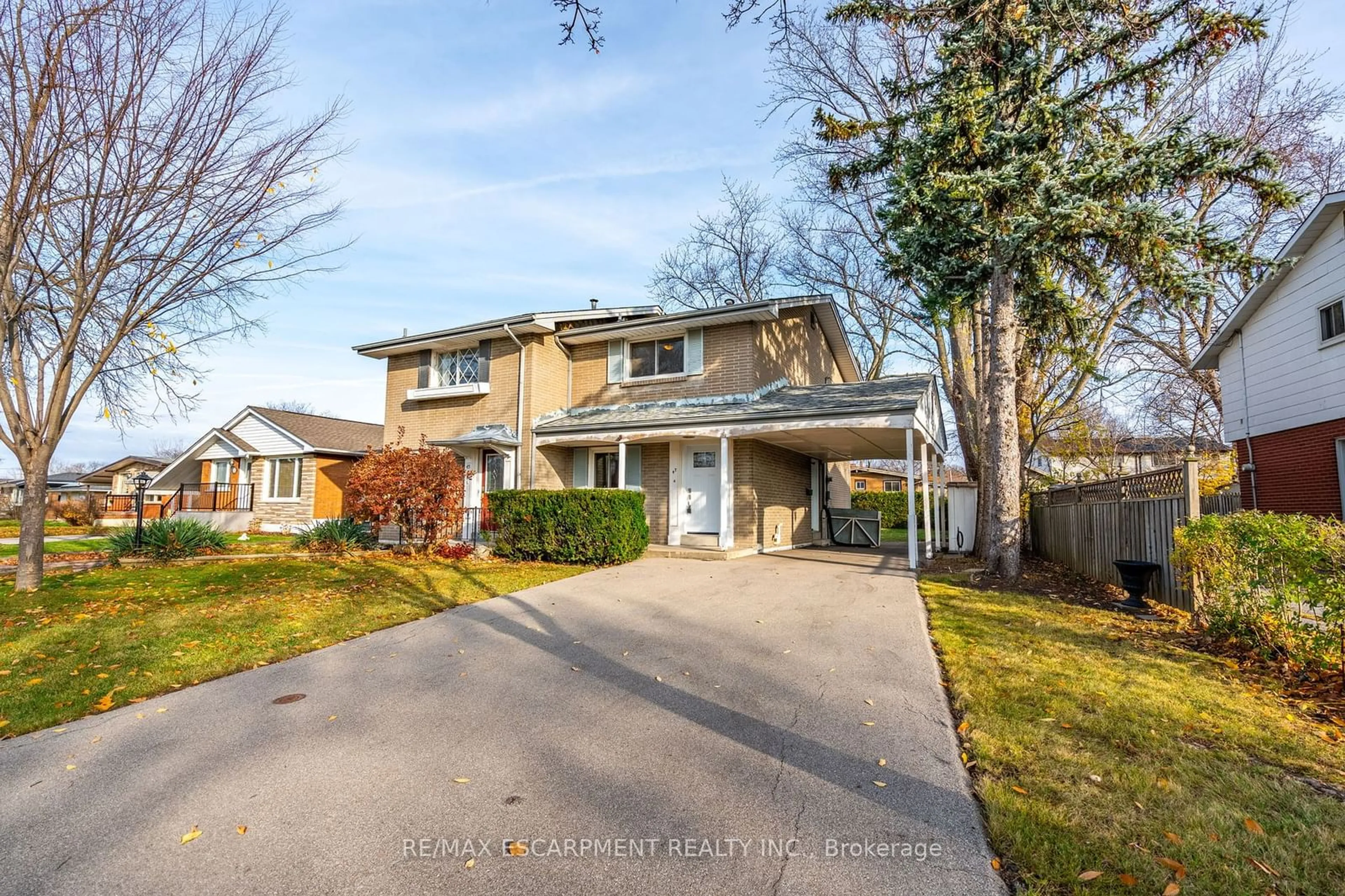 Frontside or backside of a home, the fenced backyard for 47 Bobolink Rd, Hamilton Ontario L9A 2P3