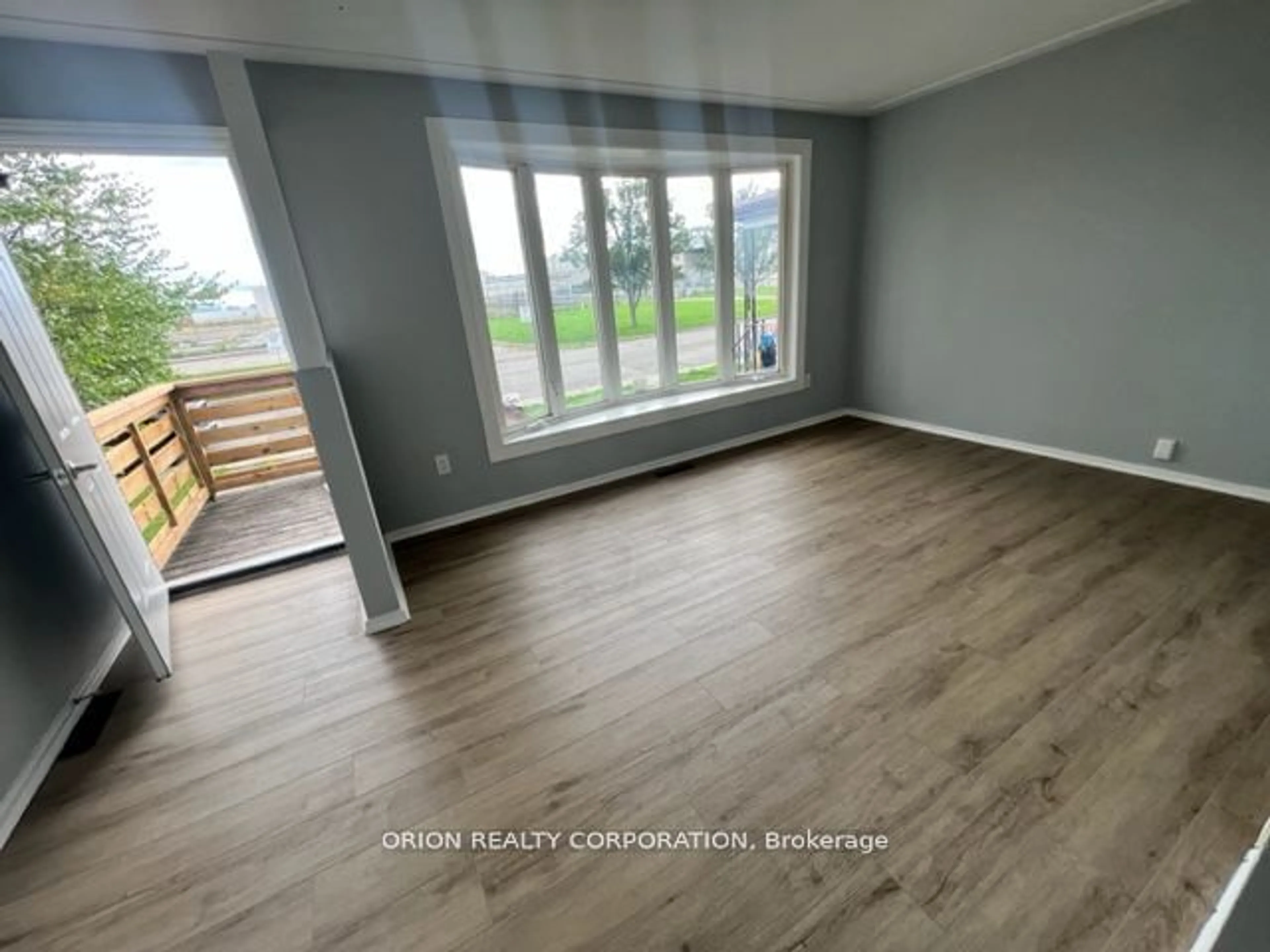 A pic of a room, wood floors for 359 .5 Strathearn Ave, Hamilton Ontario L8H 5L2