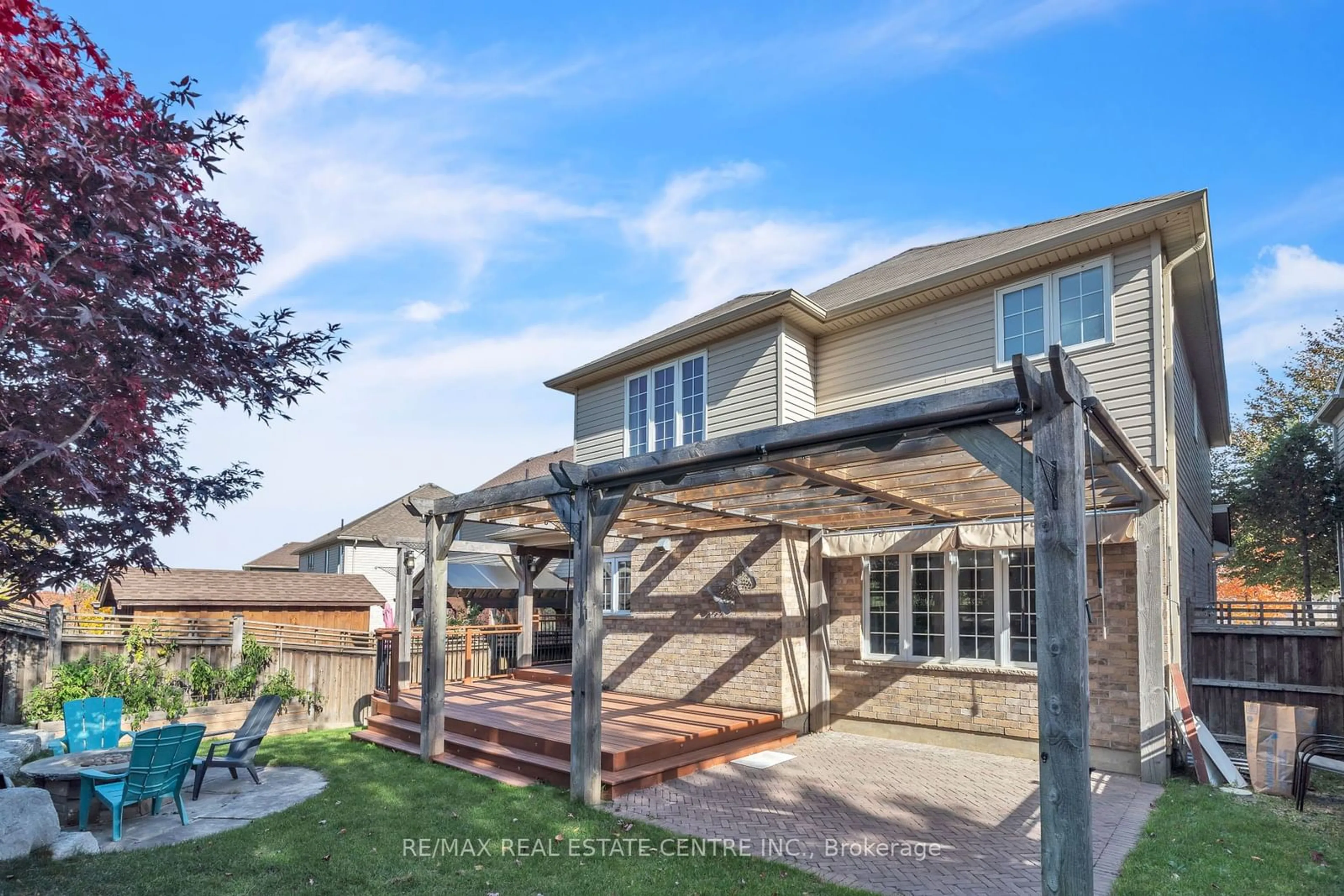 Frontside or backside of a home, the fenced backyard for 48 Isaiah Dr, Kitchener Ontario N2E 0B2