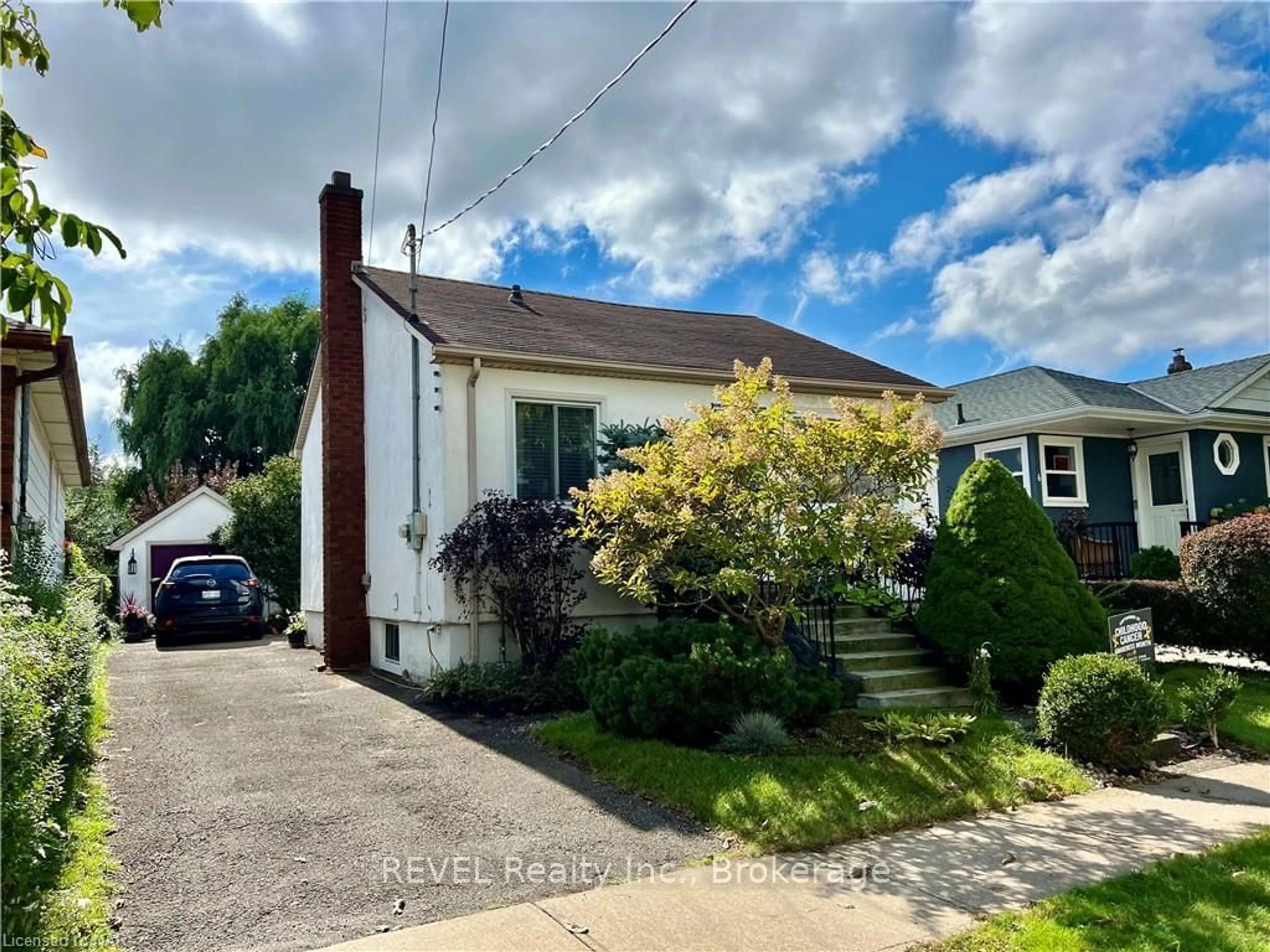 Frontside or backside of a home, the fenced backyard for 8 GARNET St, St. Catharines Ontario L2M 5E5