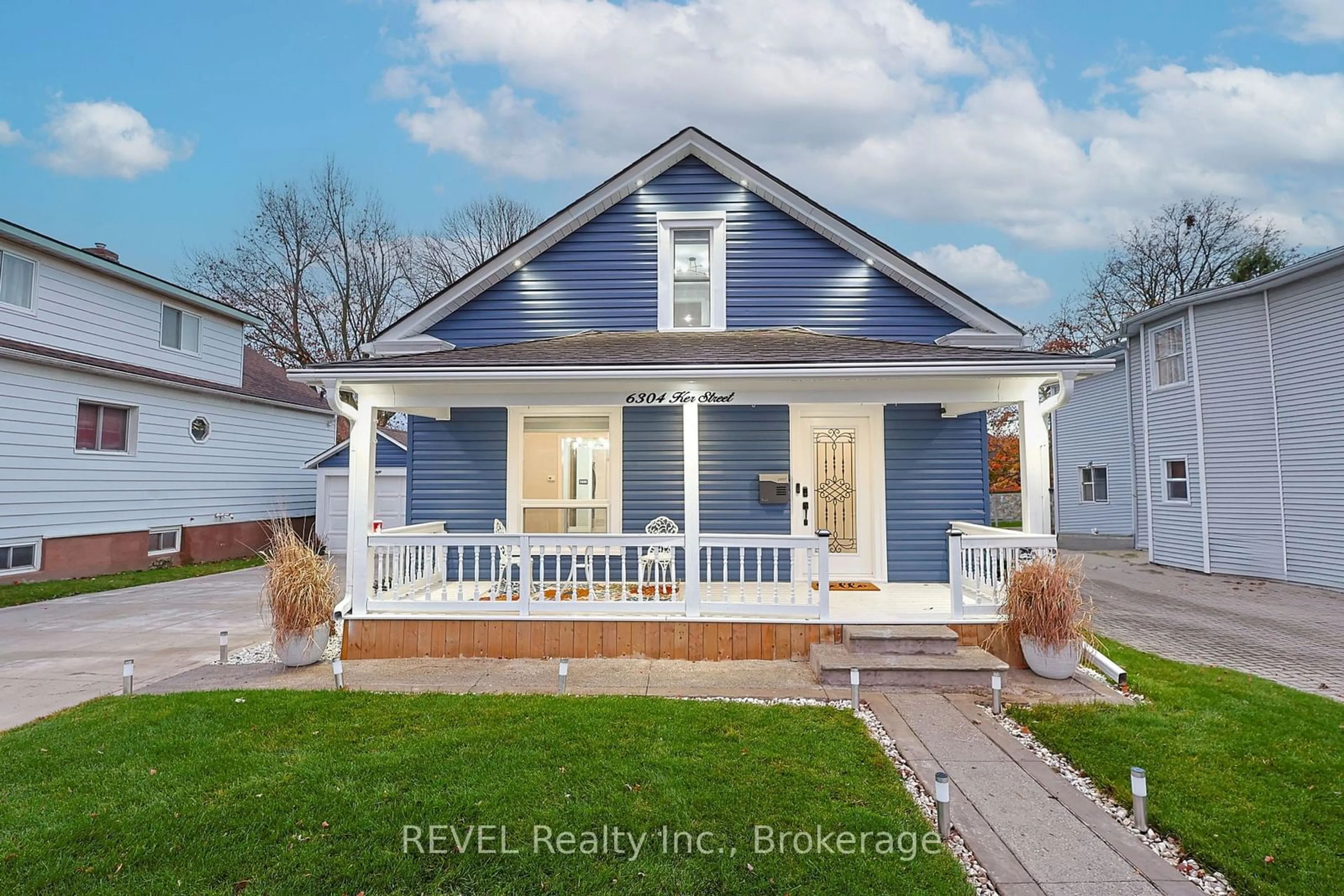 Frontside or backside of a home, the fenced backyard for 6304 KER St, Niagara Falls Ontario L2G 1X8