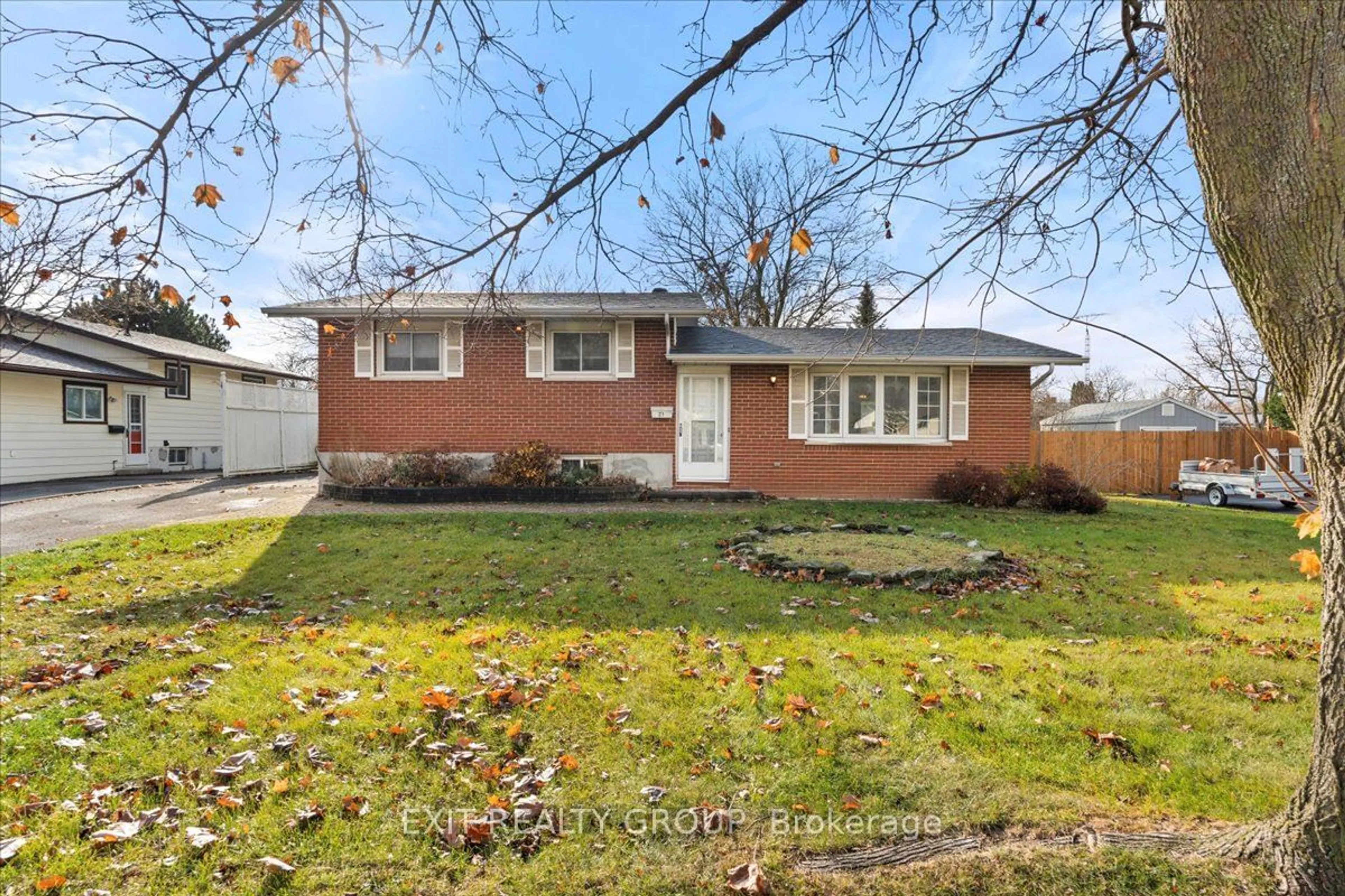 Frontside or backside of a home, the fenced backyard for 21 Hollandale Ave, Quinte West Ontario K8V 2C5