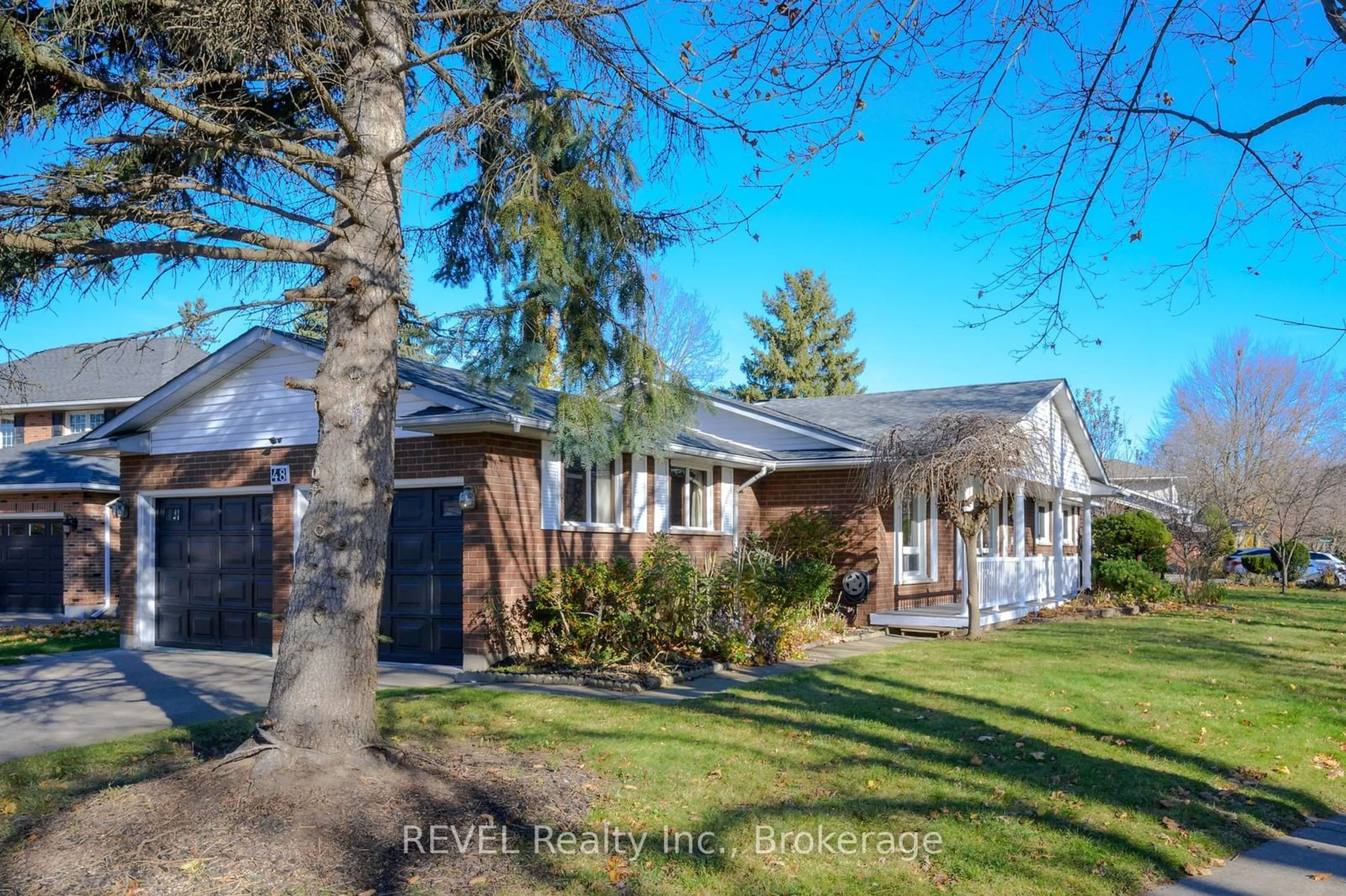 Frontside or backside of a home, the fenced backyard for 48 Port Master Dr, St. Catharines Ontario L2N 7H7