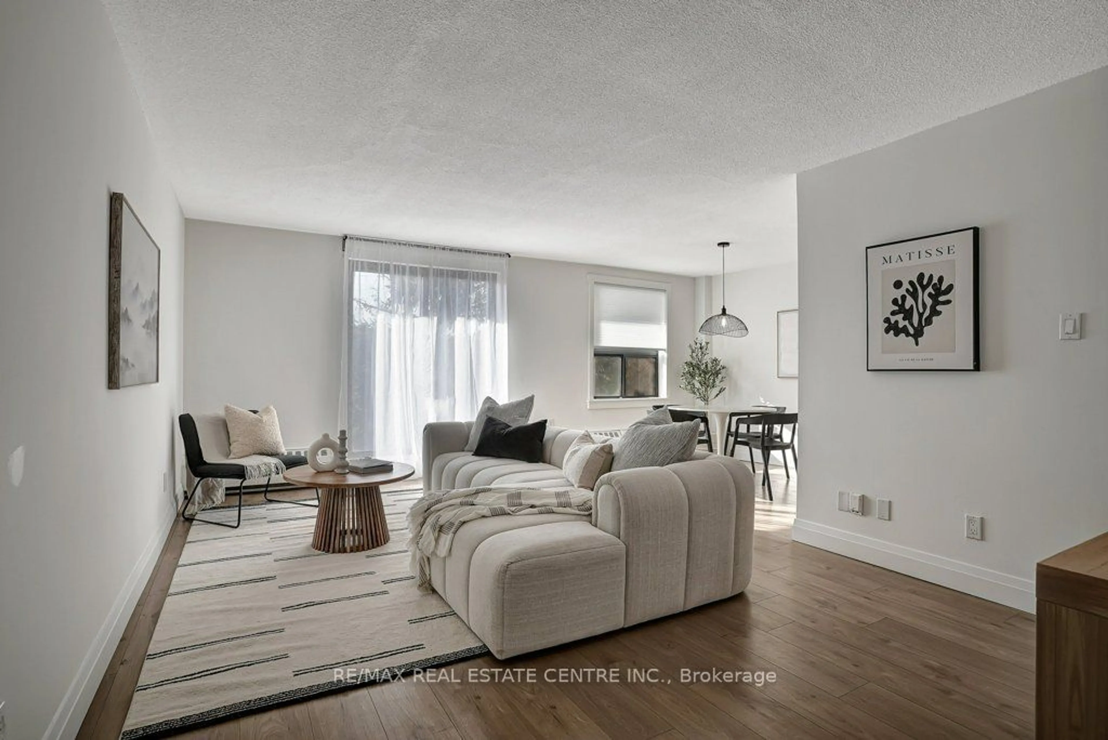 Living room, wood floors for 1100 Courtland Ave #107, Kitchener Ontario N2C 2H9