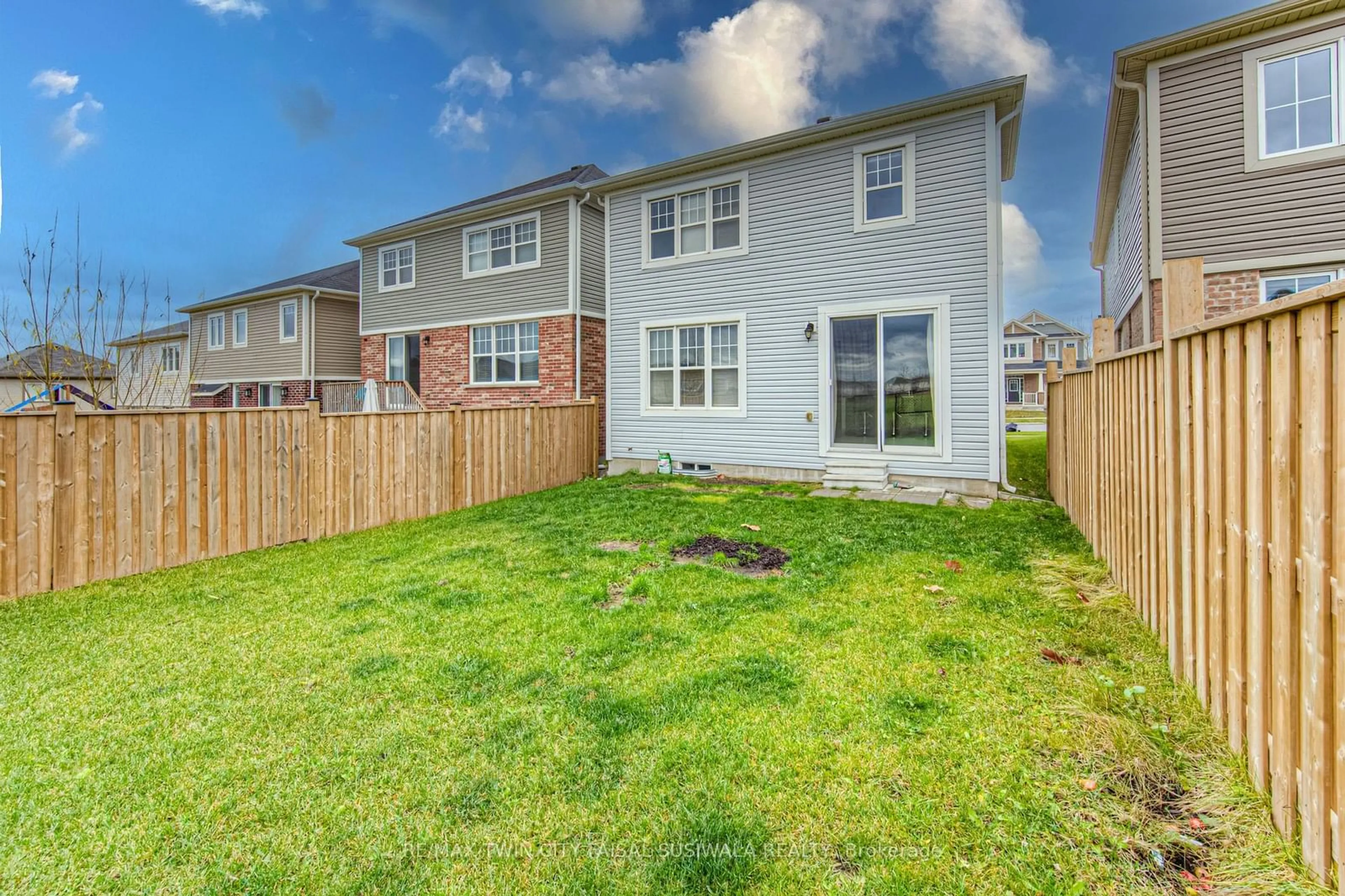 Frontside or backside of a home, the fenced backyard for 68 Ridge Rd, Cambridge Ontario N3E 0C6