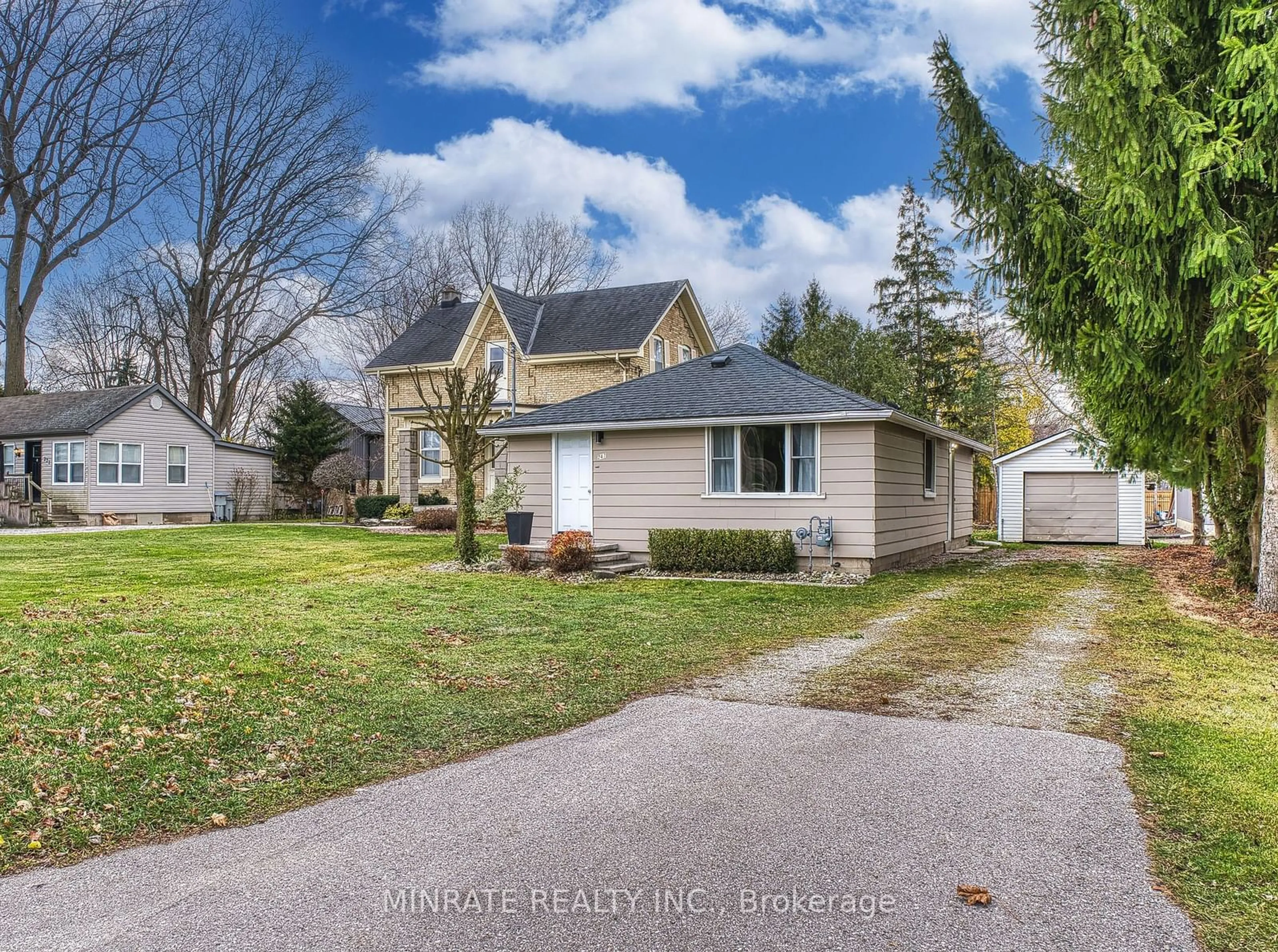 Frontside or backside of a home, the fenced backyard for 247 Huron St, South Huron Ontario N0M 1S2