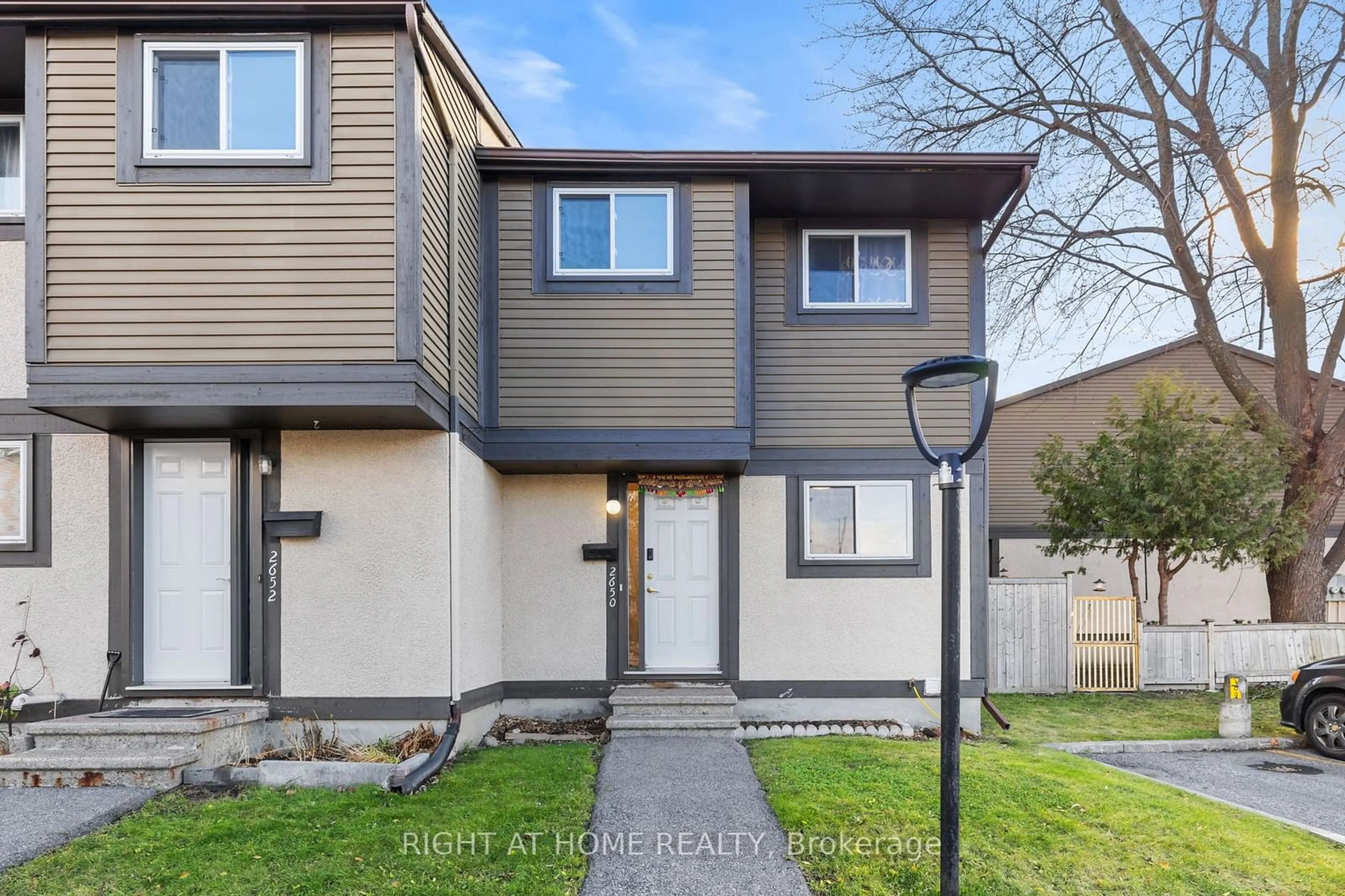 A pic from exterior of the house or condo, the fenced backyard for 2650 Pimlico Cres #107, Blossom Park - Airport and Area Ontario K1T 2A8